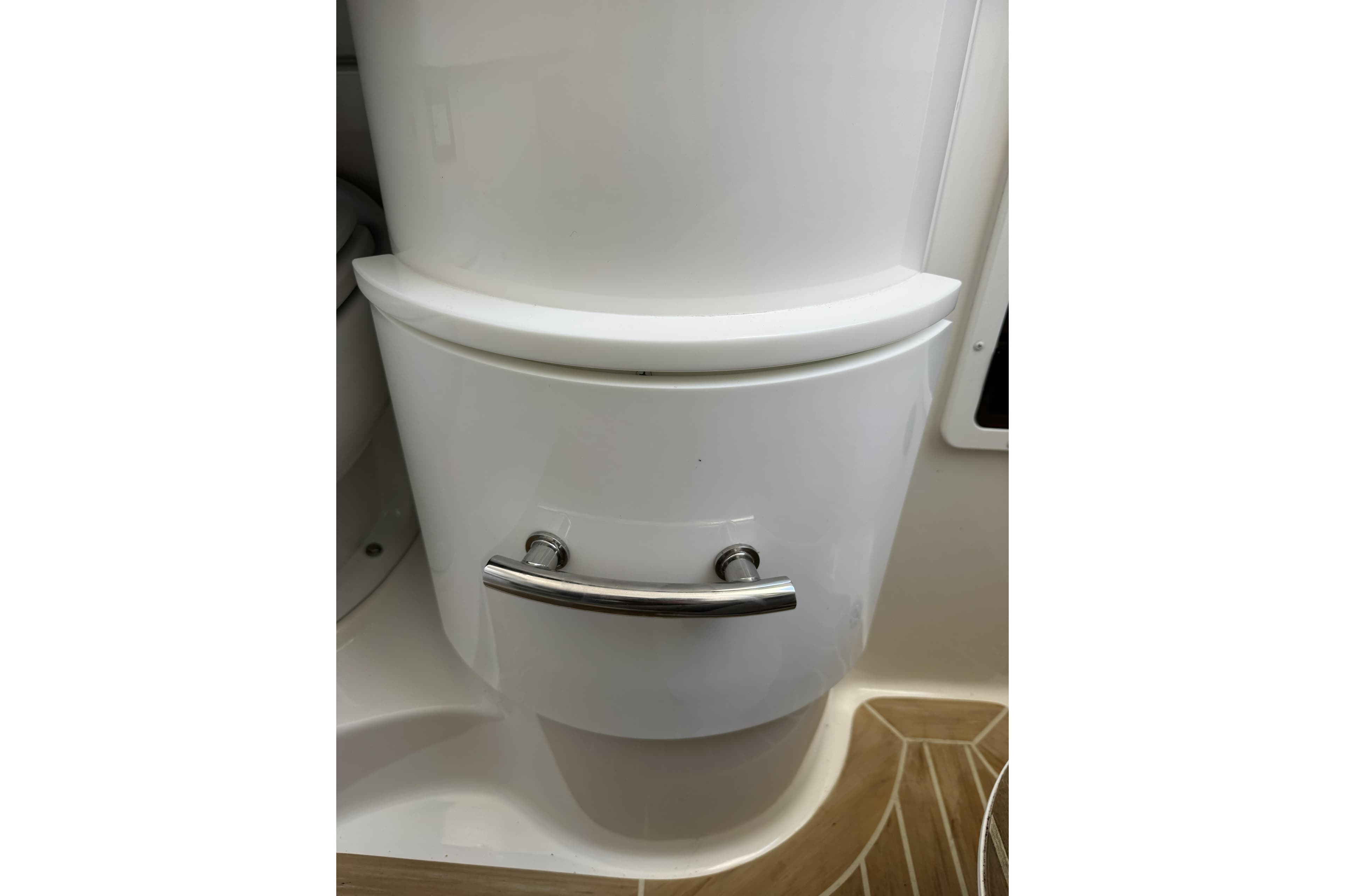 2018 Regulator 34SS boat interior with sleek white cabinetry and chrome handle.