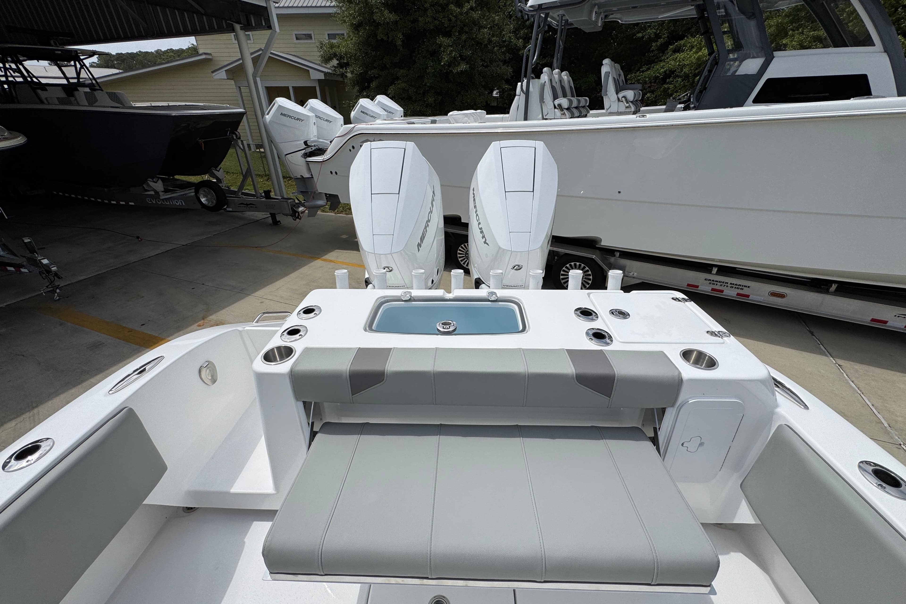 2026 Cape Horn 34 XS boat with dual Mercury engines, featuring a sleek seating area.