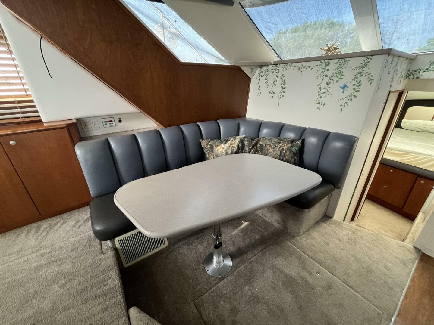 1996 Silverton 372 Signature yacht interior with dining area and cushioned seating.