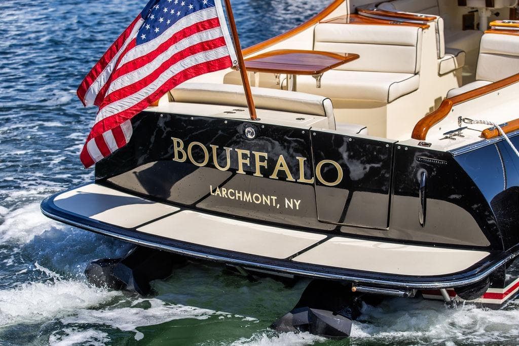 2014 Hinckley Talaria 34 boat with American flag, named "Bouffalo," in Larchmont, NY waters.