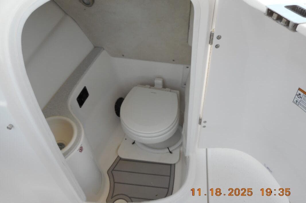 2026 Sea Fox 228 Traveler boat interior with compact marine toilet.