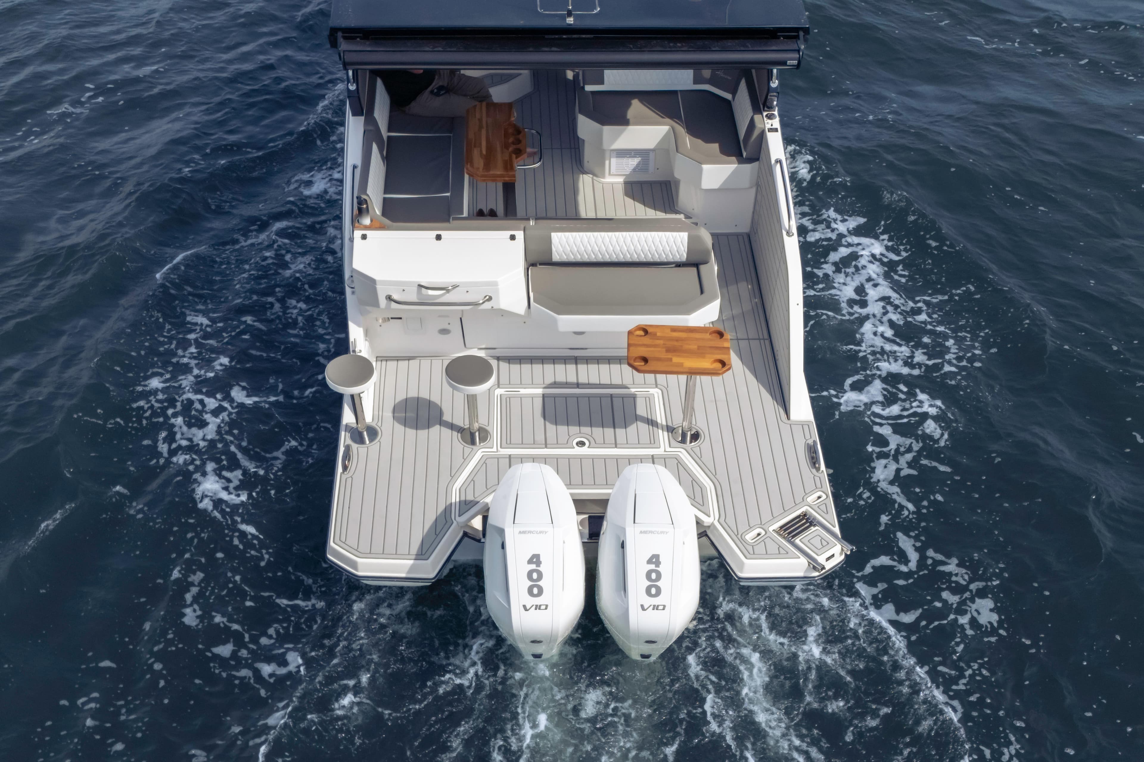 Aerial view of 2025 Hanover 387 boat with dual engines on open water.