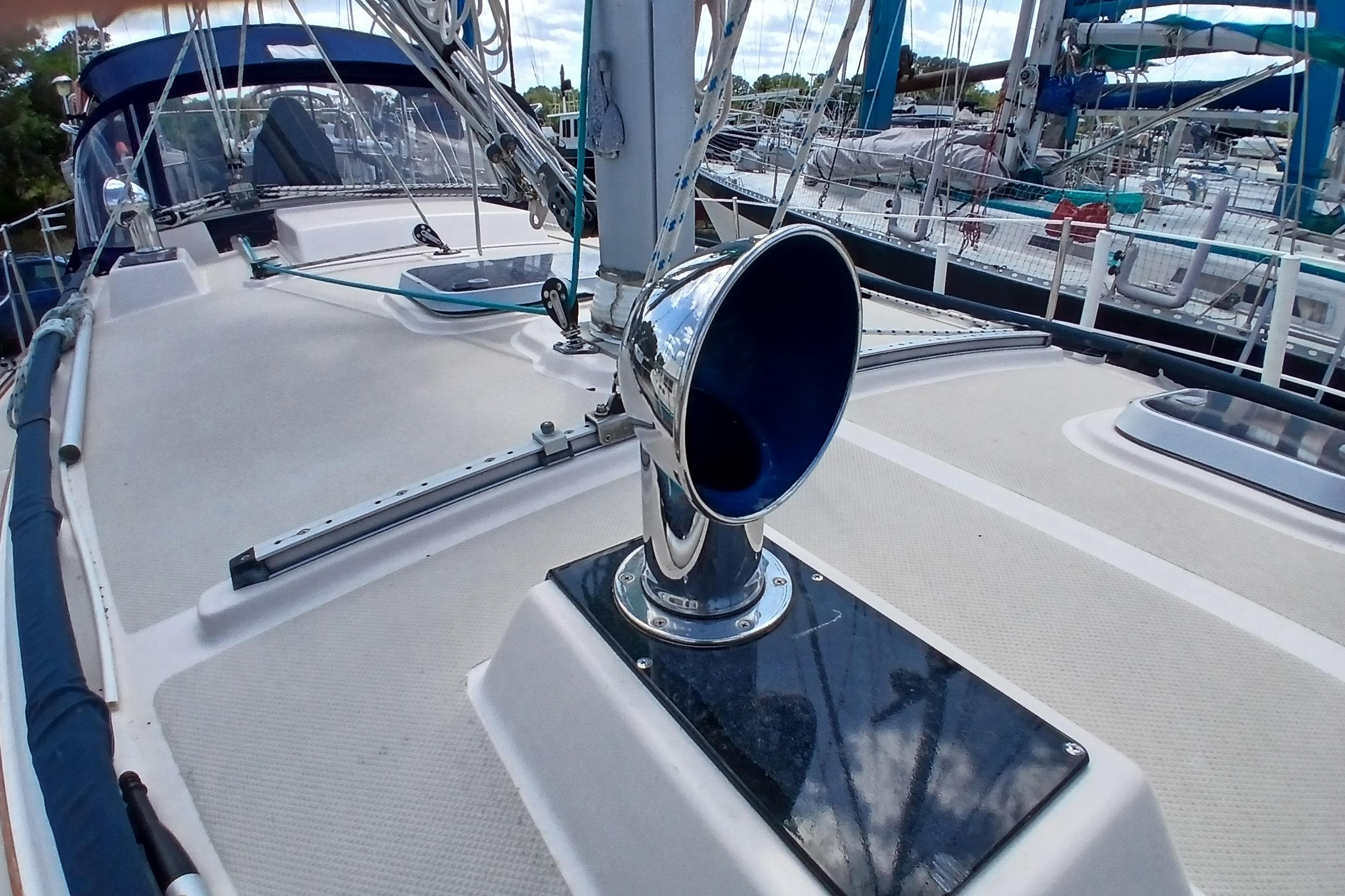 1995 Island Packet 37 sailboat deck with chrome vent and rigging details.