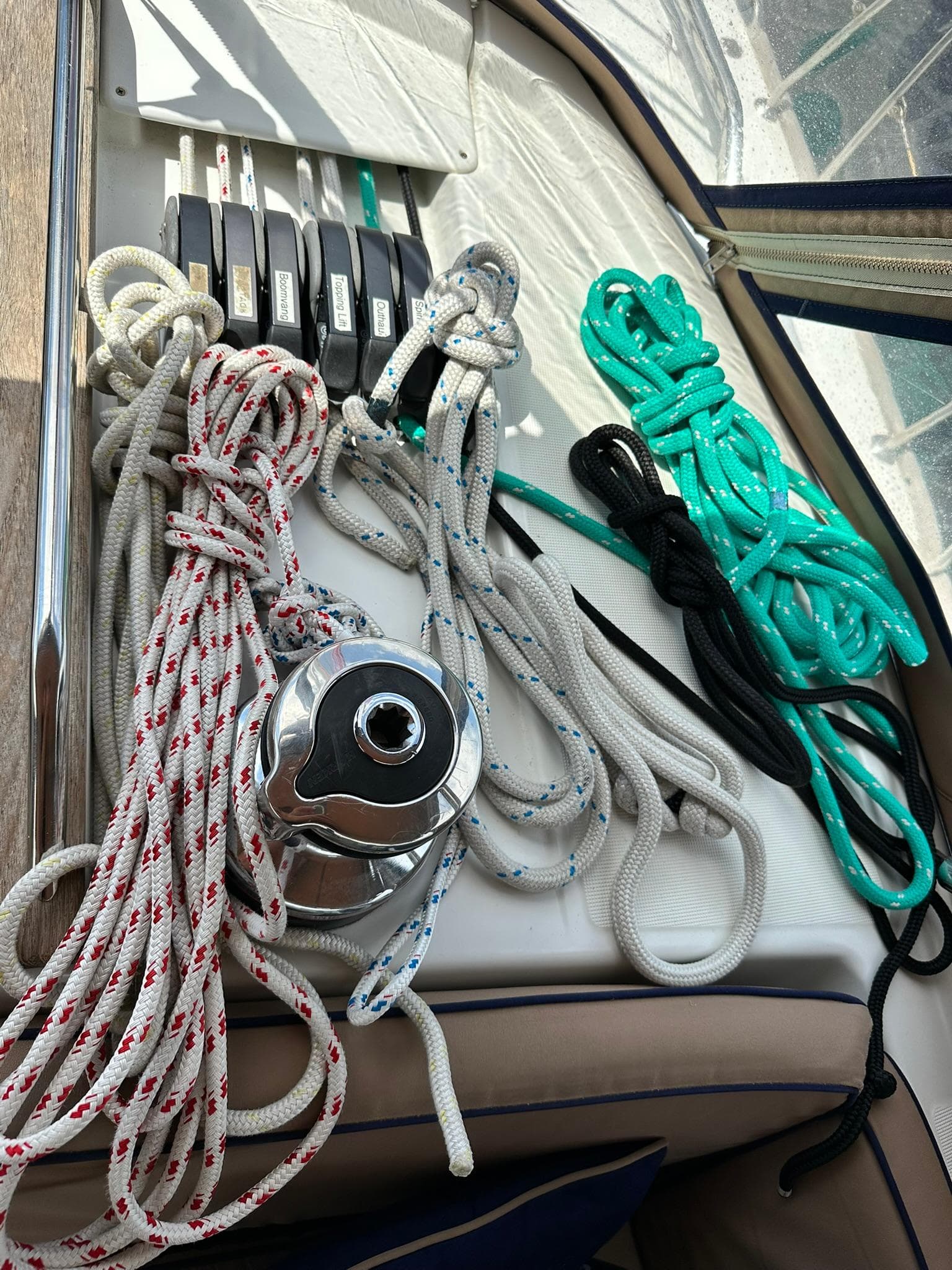 Ropes and winch on Jeanneau Sun Odyssey 45 DS, 2011 model sailboat deck.