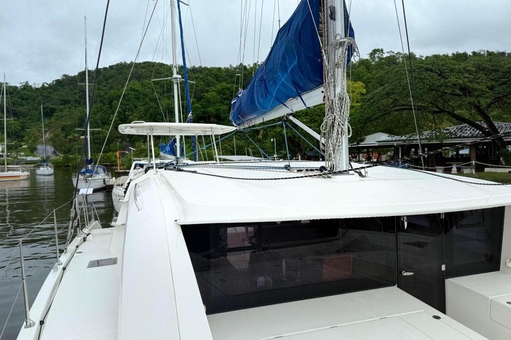 2016 Leopard 404 catamaran docked in a serene marina setting.