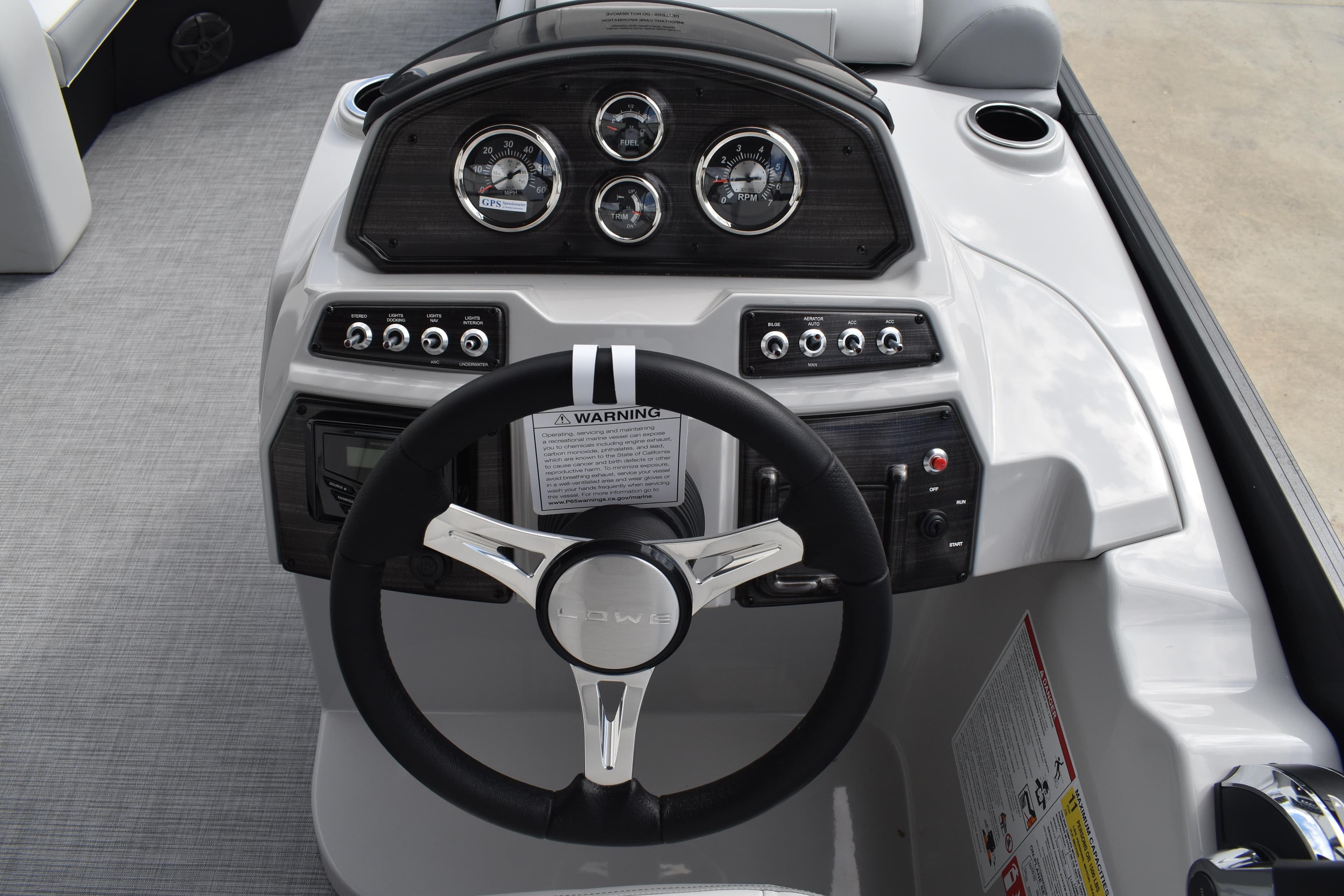 2026 Lowe SS 210 boat dashboard with steering wheel and instrument panel.