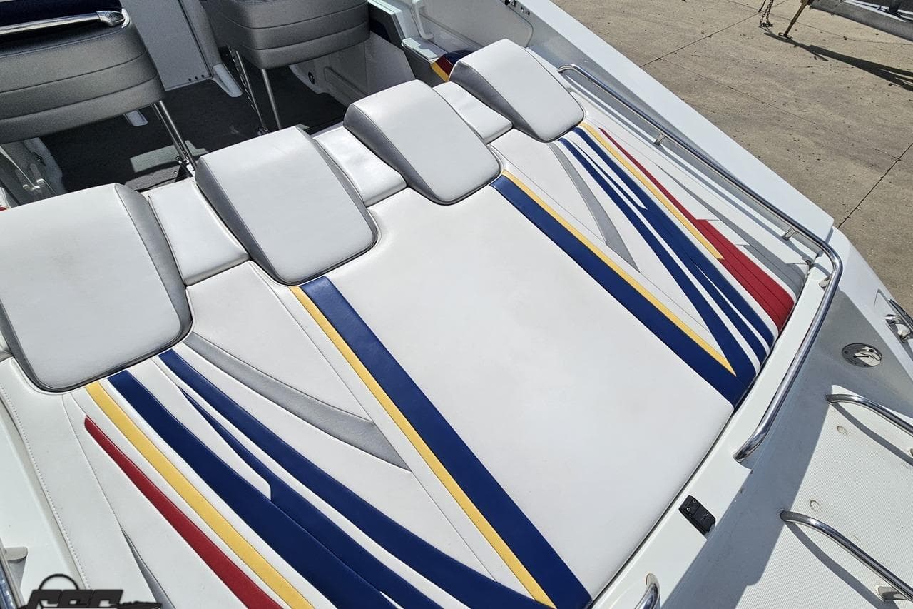 2008 Formula 271 FASTech boat interior with colorful striped upholstery design.