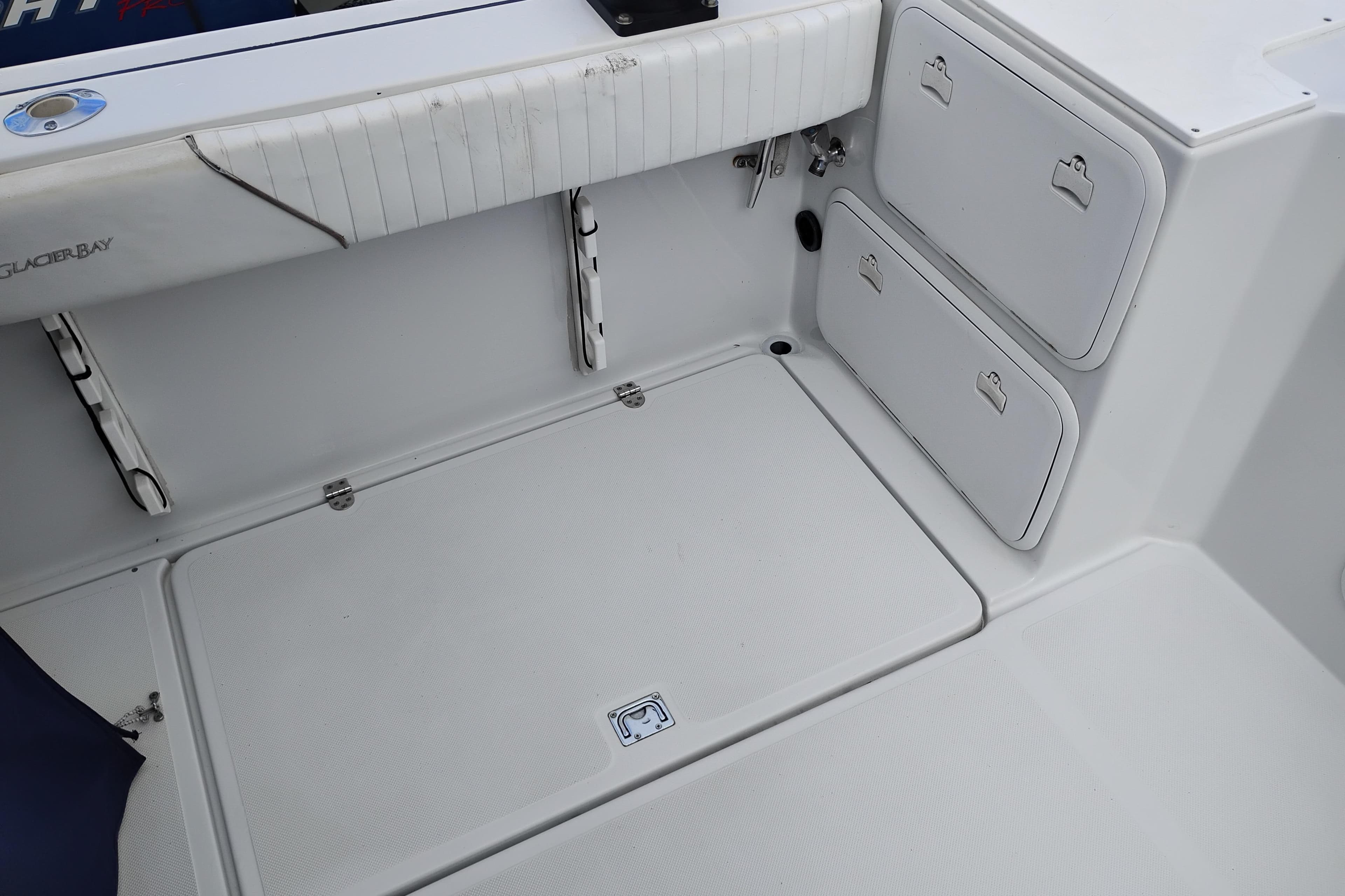 2007 Glacier Bay 2685 Coastal Runner boat interior with storage compartments.