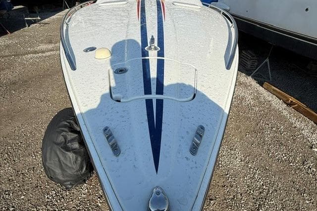 2004 Formula 292 FASTech boat bow with sleek design and blue stripe detailing.