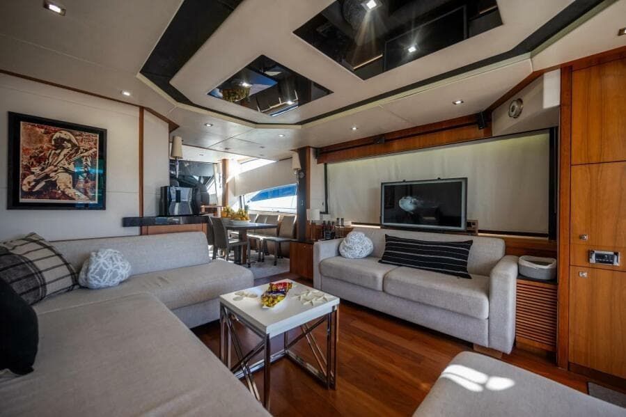 Luxurious interior of 2015 Sunseeker 75 yacht with modern decor and comfortable seating.