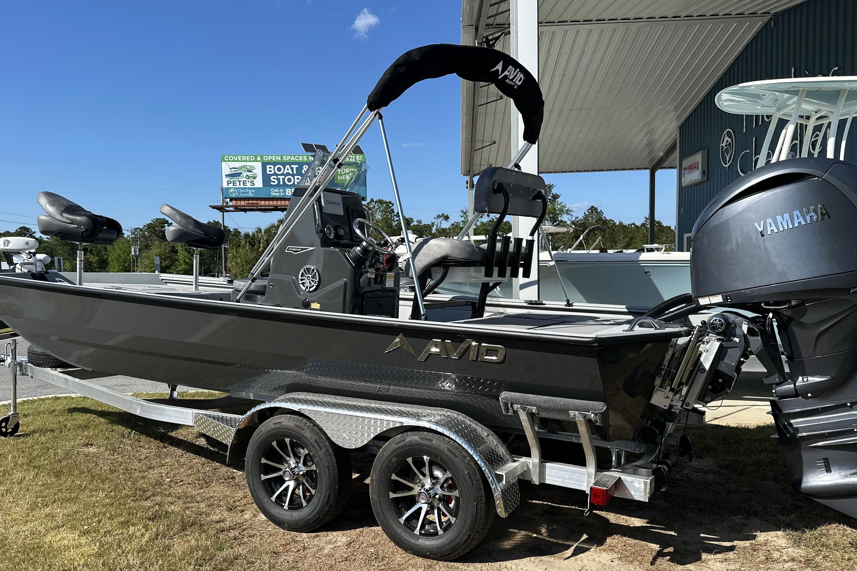 2026 Avid 20 Rogue CC boat on trailer with Yamaha engine, parked outdoors.