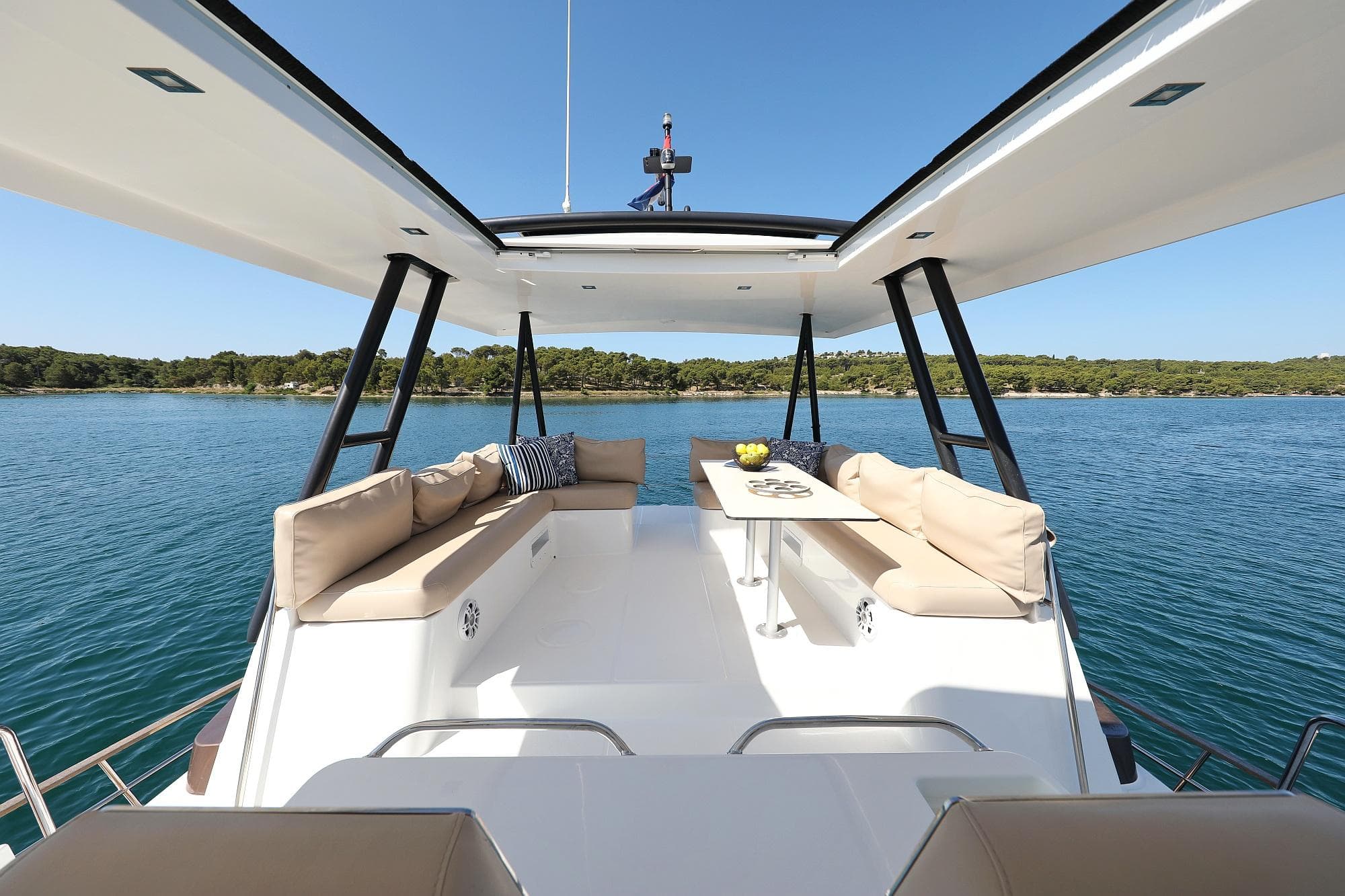 Luxurious Bali 4.3 MY 2020 yacht with spacious deck and scenic water view.