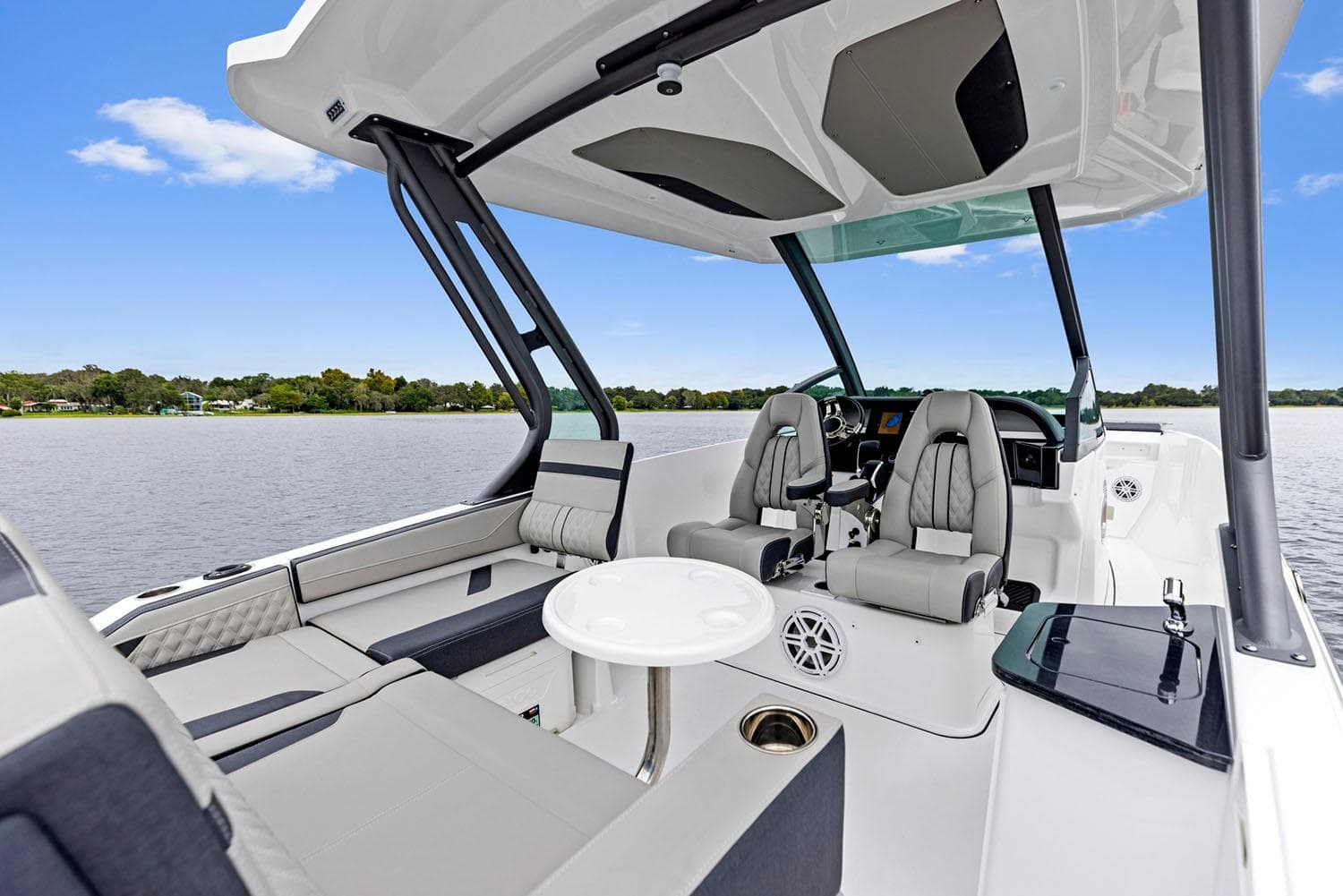 Manufacturer Provided Image: 2026 Monterey Elite 27 OB boat interior with luxurious seating and modern design on a serene lake.