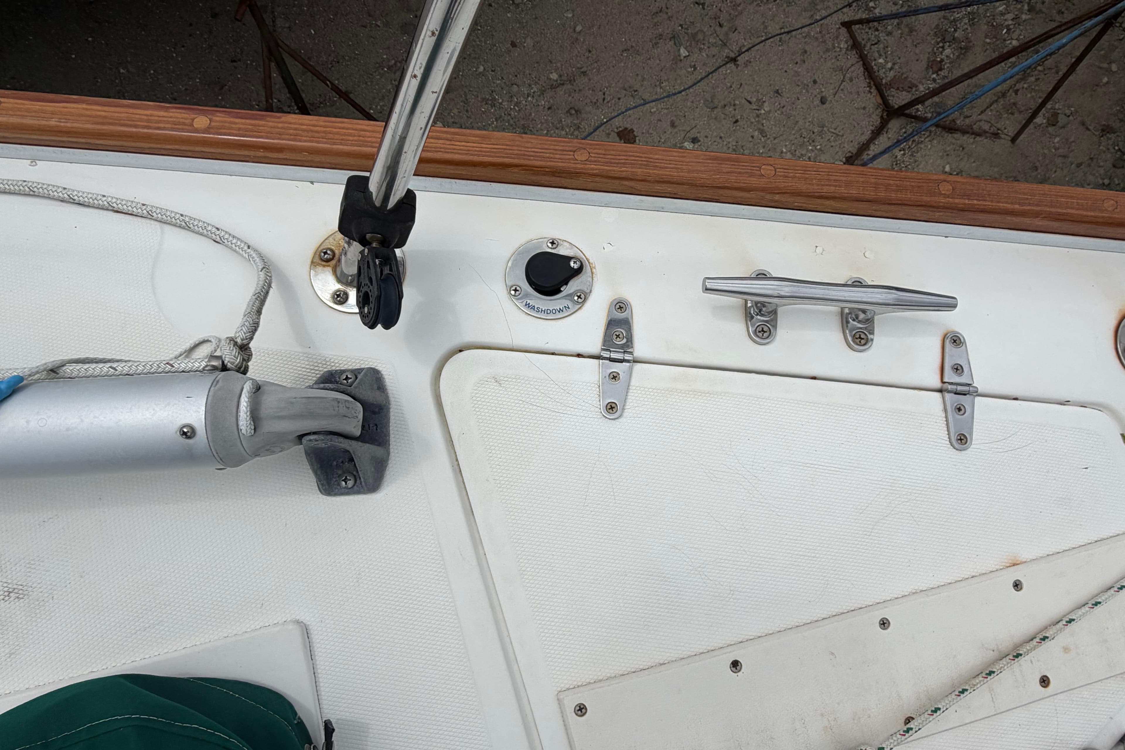 Deck fittings on a 1982 Sabre 34 sailboat, featuring cleats and rigging hardware.