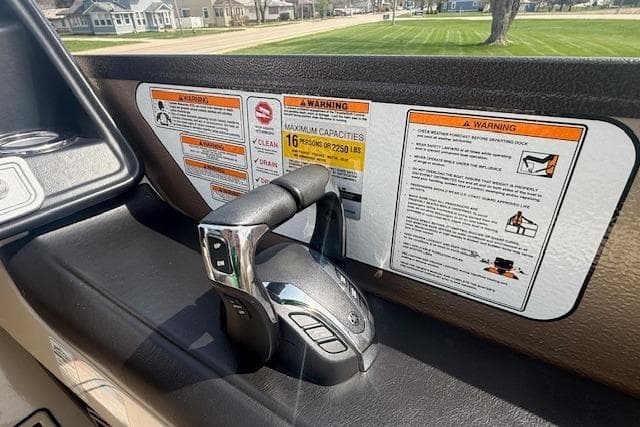 Control panel of a 2021 Premier 250 Grand Majestic RF boat with safety warnings.