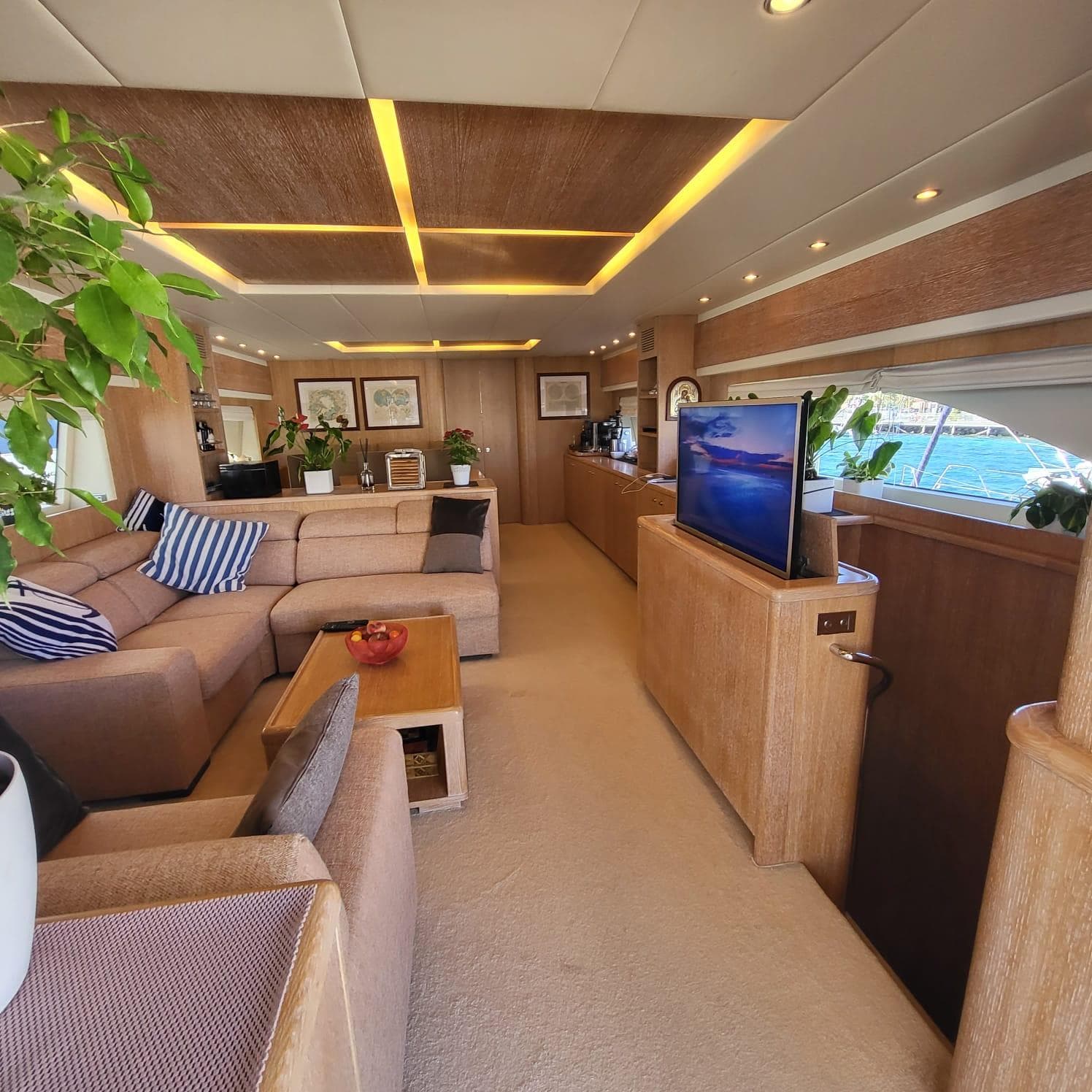 Luxurious interior of 2006 PerMare Amer 86 yacht with modern decor and comfortable seating.