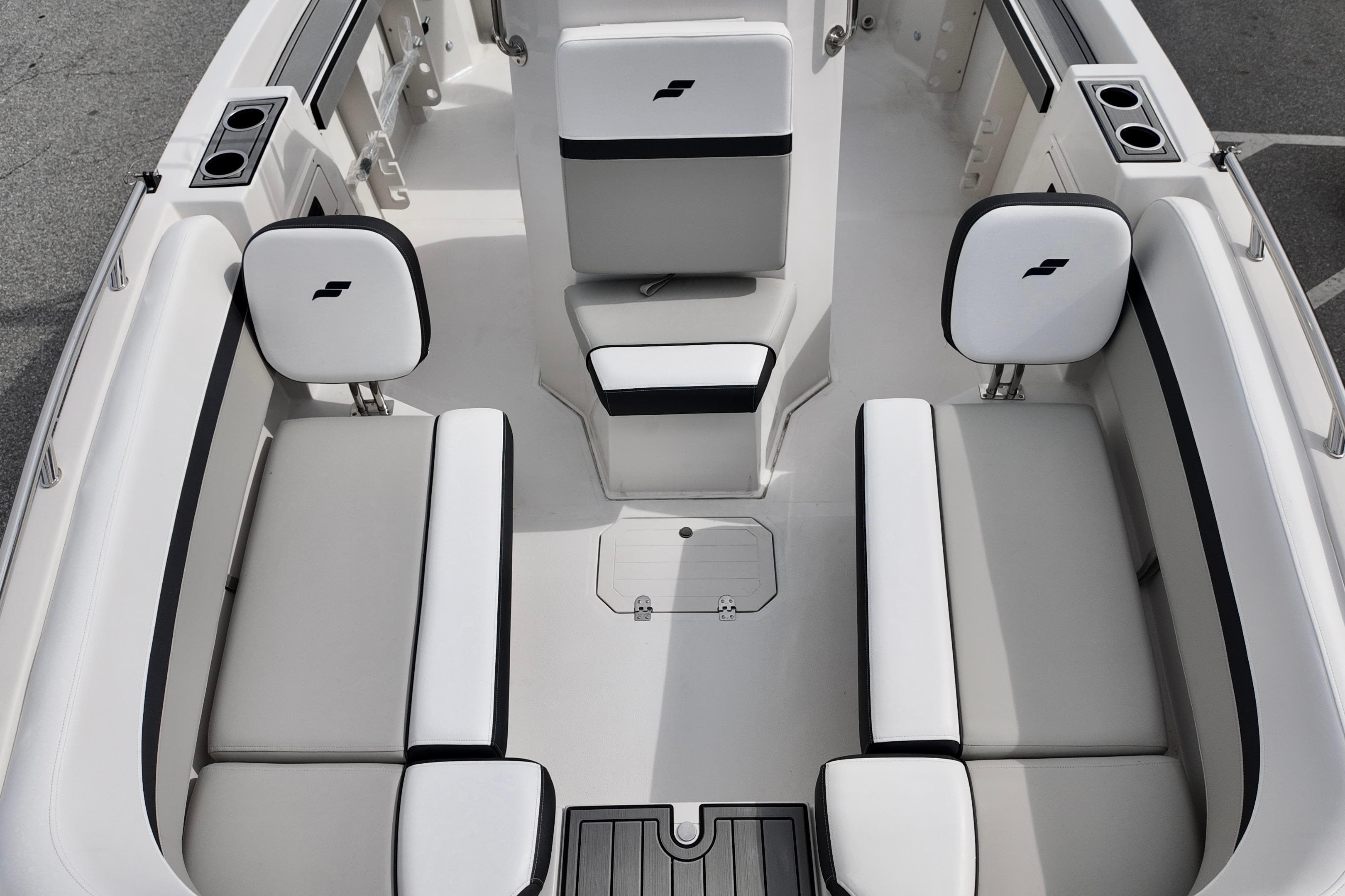 2026 Starcraft SVX 191 OB CC boat interior with white and black seating.