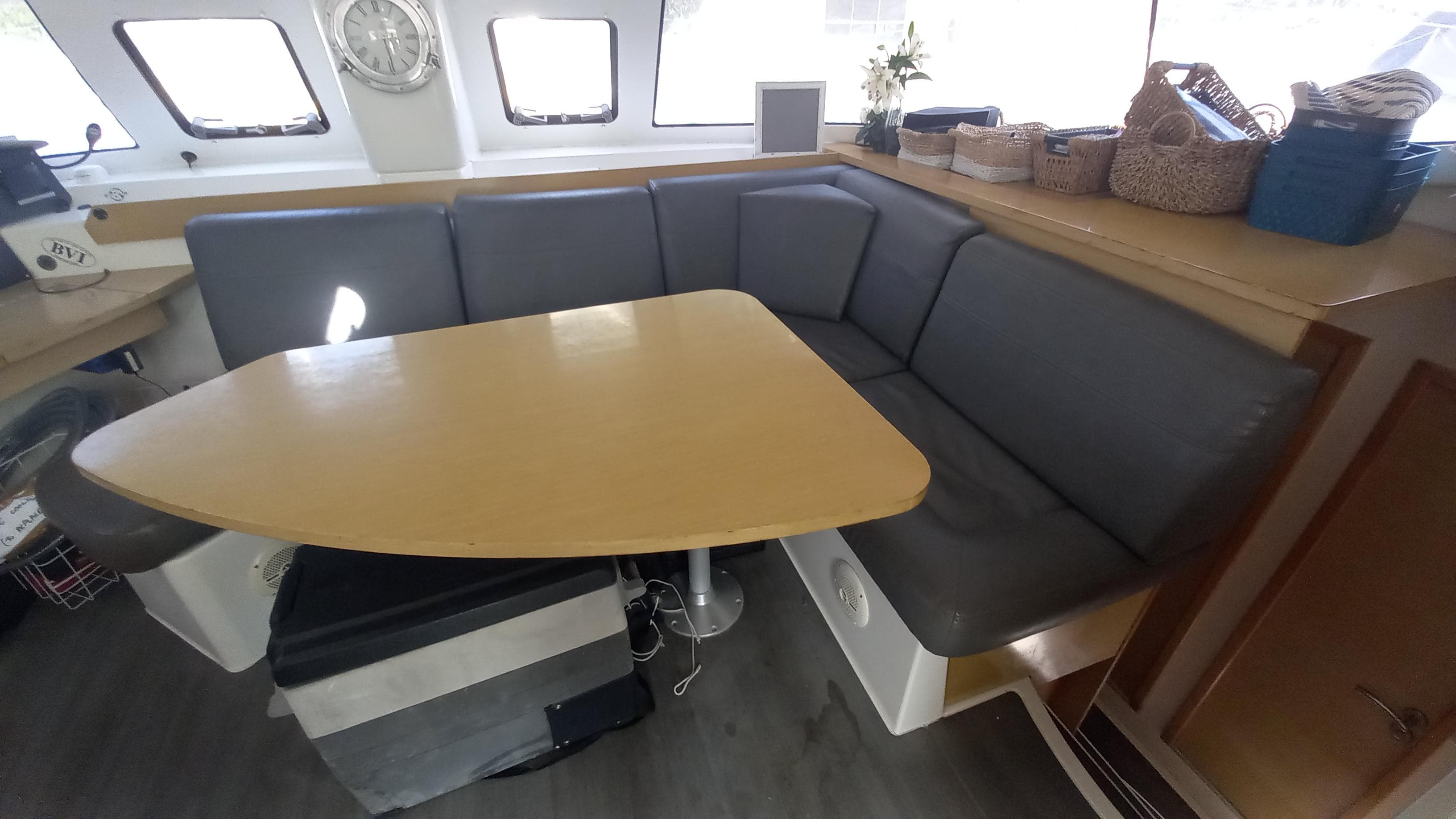 Interior of 2015 Fountaine Pajot Lipari 41 catamaran with cozy seating and wooden table.