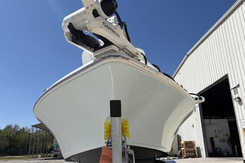 2024 Key West 210 Bay Reef boat with Garmin equipment, parked outside a warehouse.
