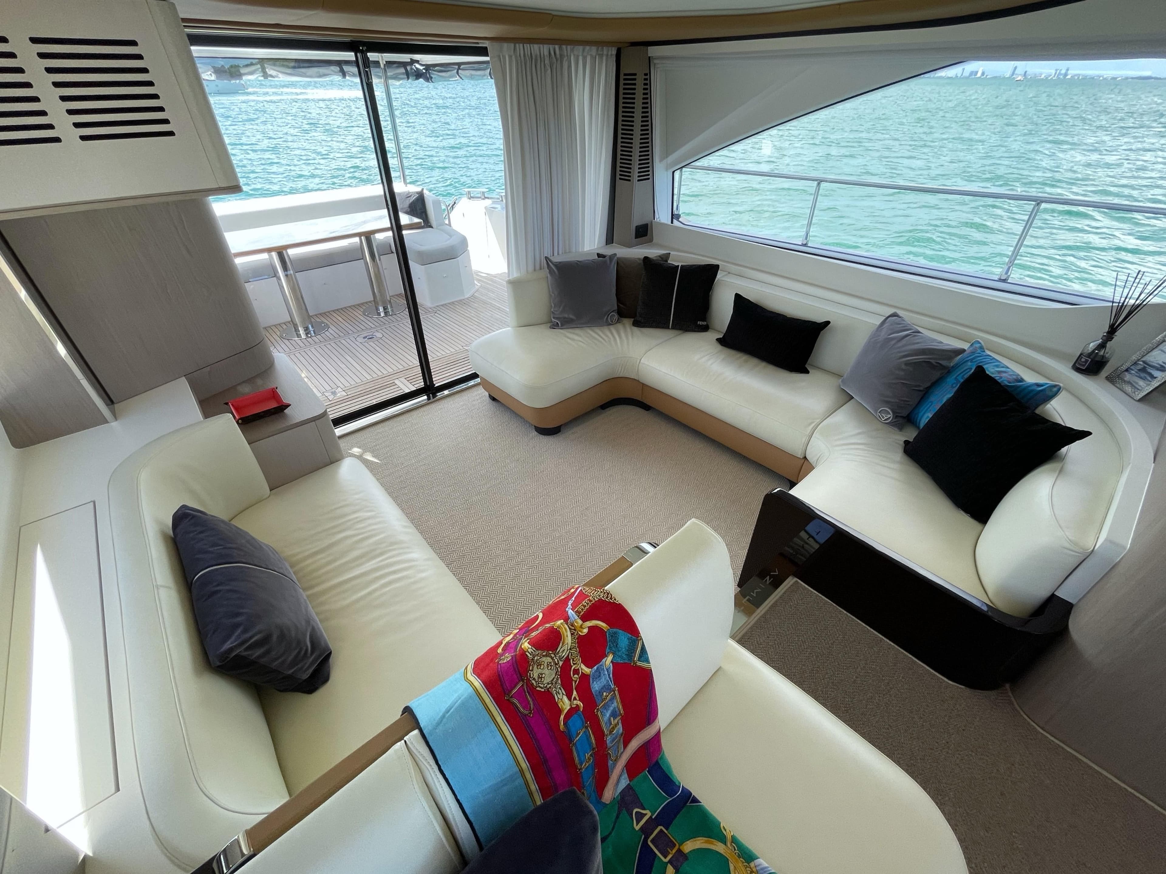 Luxurious interior of a 2020 Azimut 60 yacht with elegant seating and ocean view.