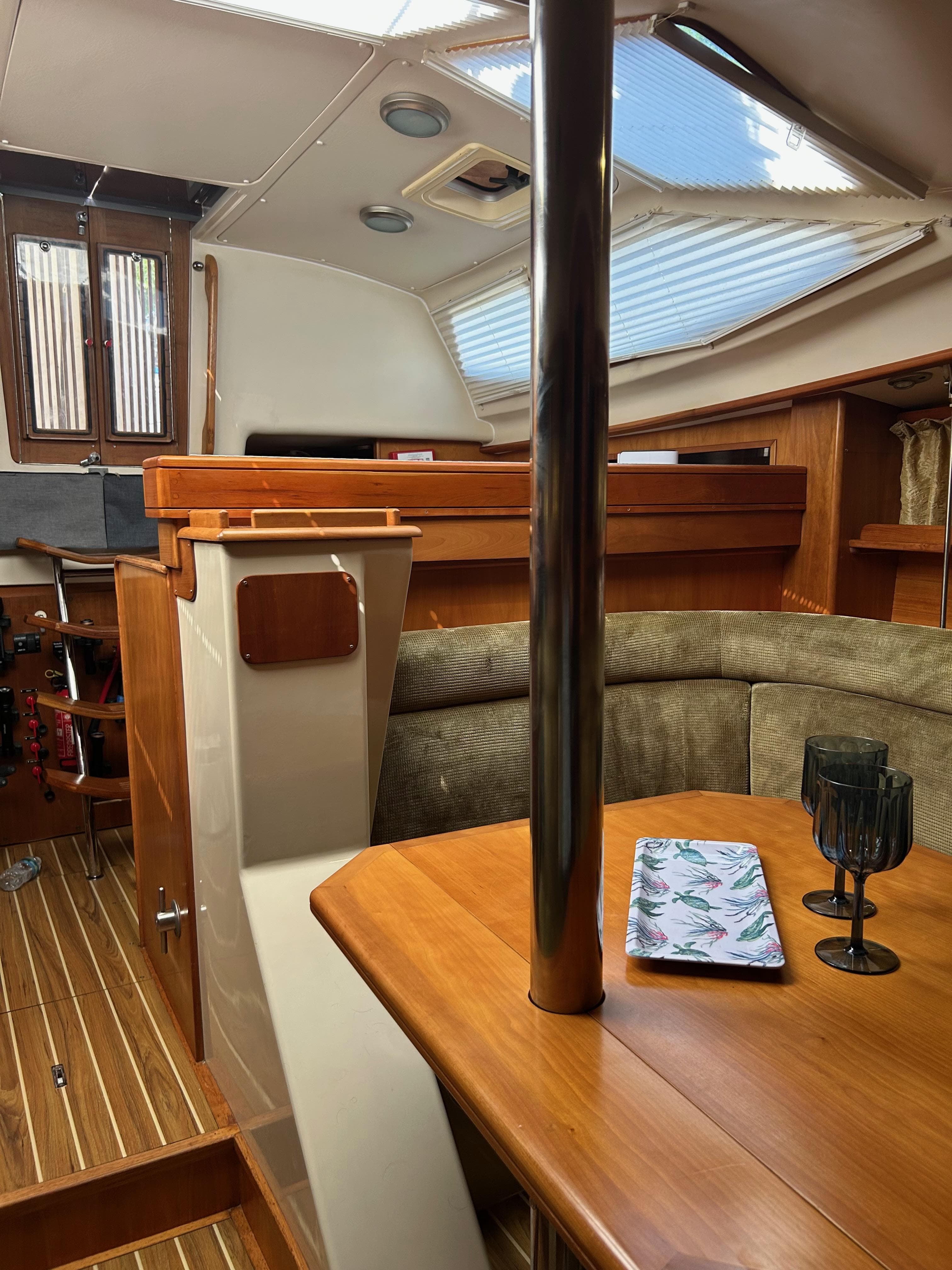 Interior of 2006 Southerly 115 Mk IV sailboat with wooden table and seating area.