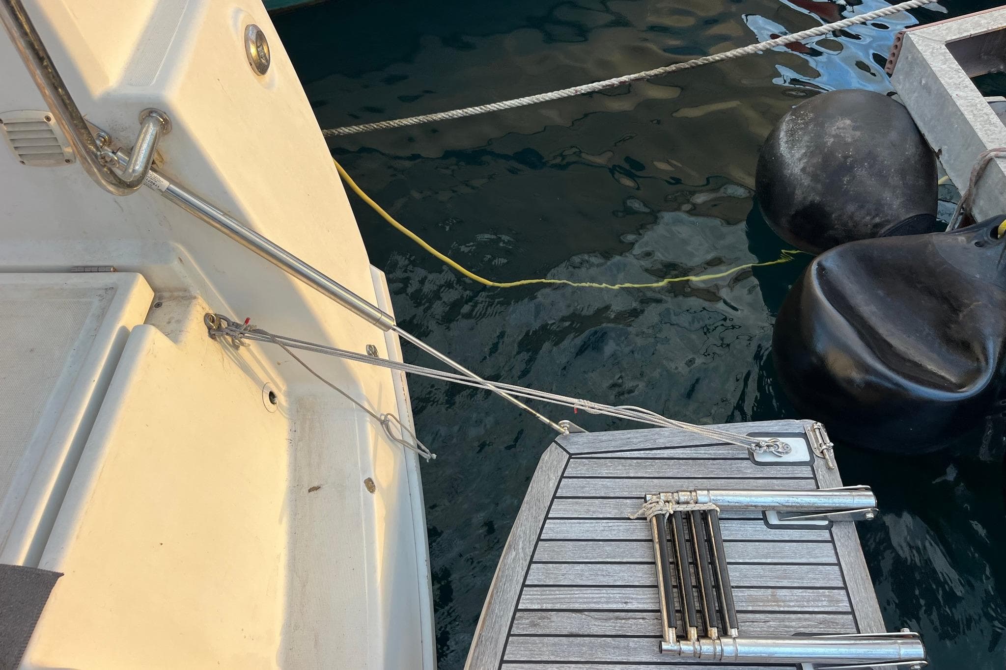 Beneteau Oceanis 41.1 yacht stern with ladder and dock ropes, 2018 model.