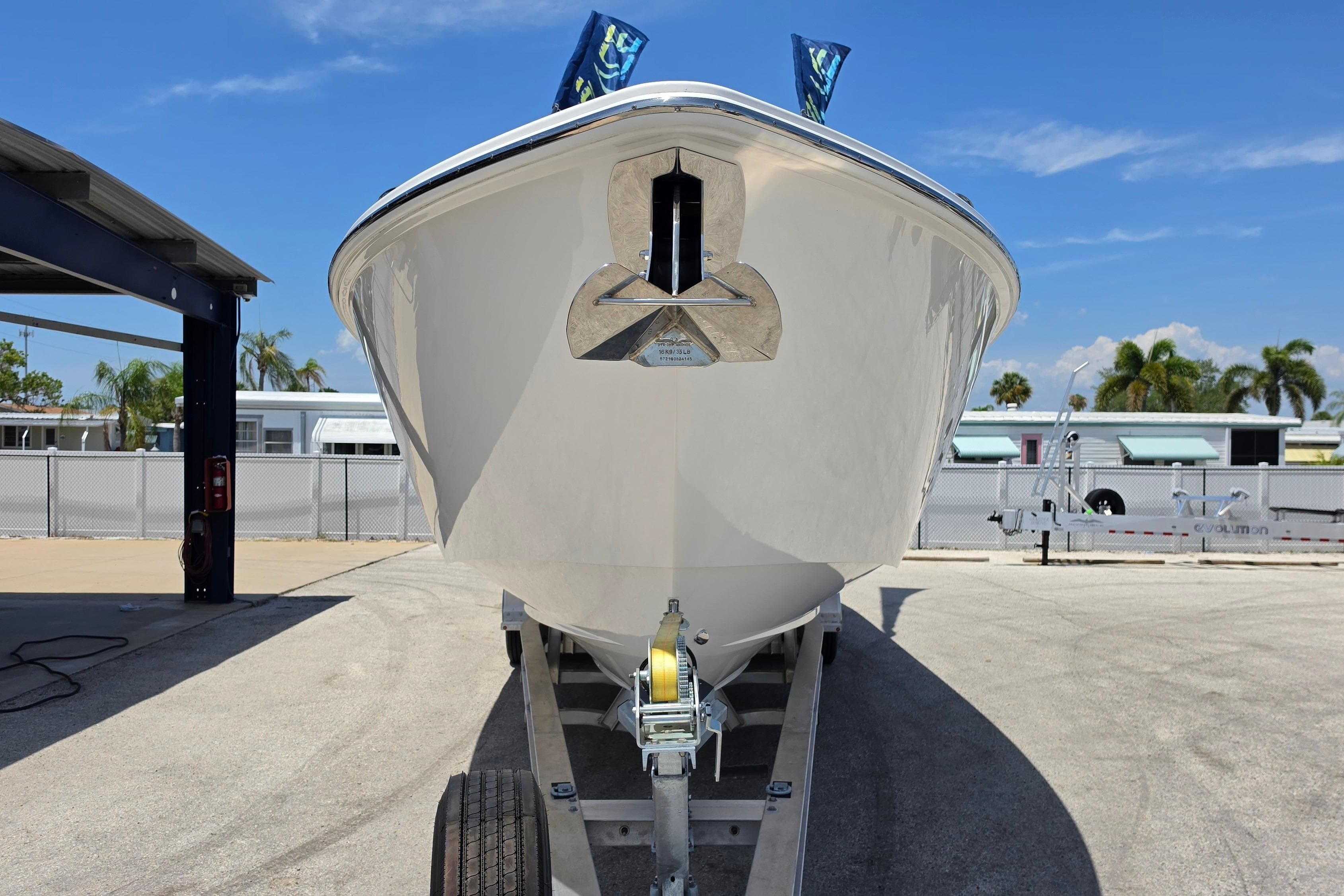 2025 Solace 37CS boat on trailer, front view, under clear blue sky.