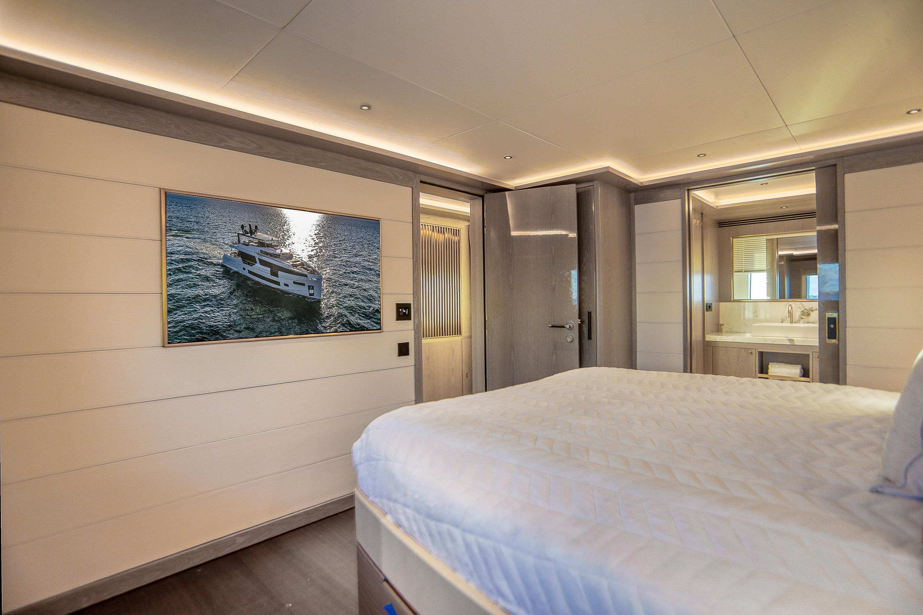 Luxurious Sirena 88 yacht bedroom interior, featuring modern design and elegant lighting, 2021 model.