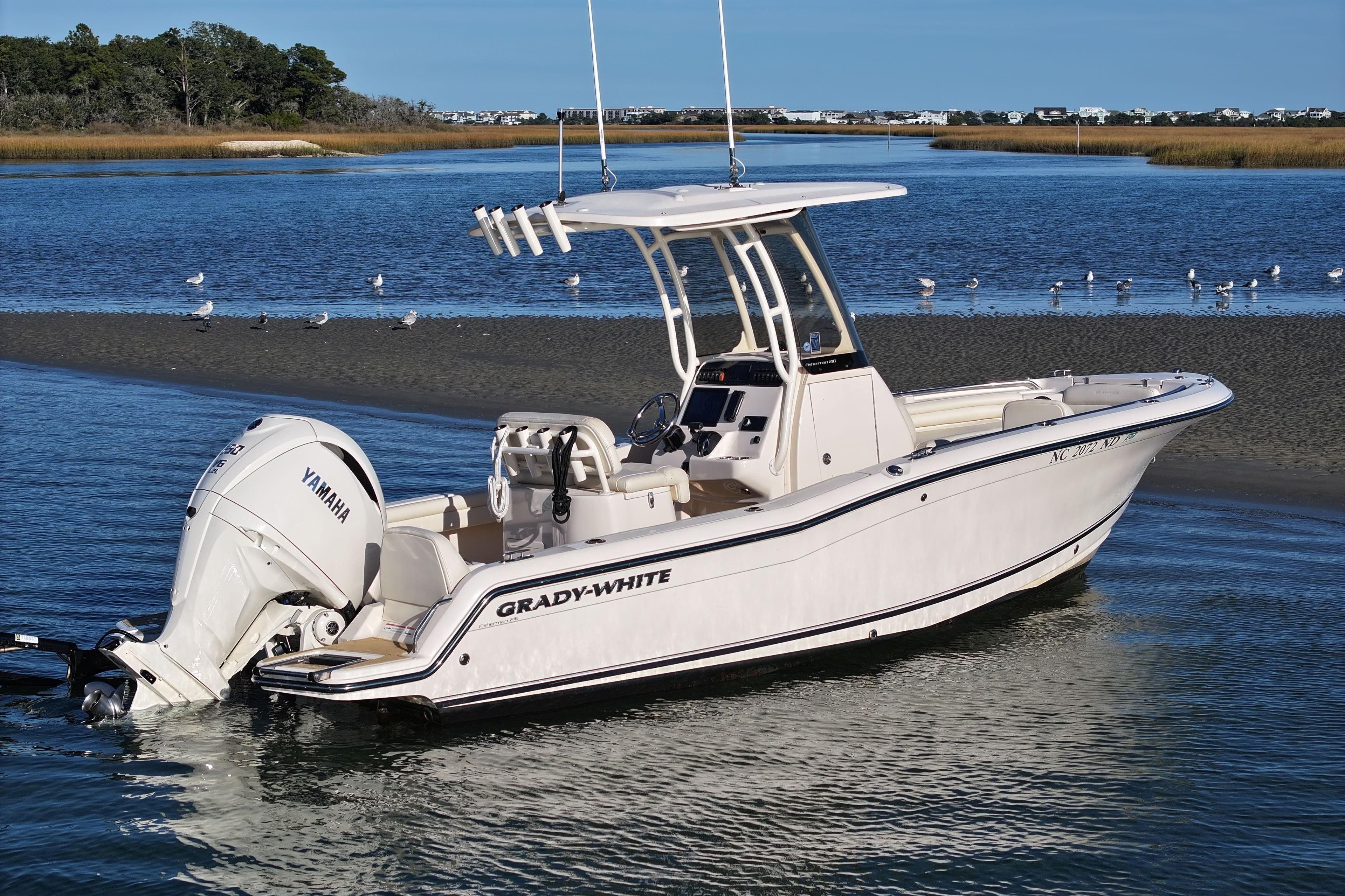2024 Grady-White Fisherman 216 boat on calm water with Yamaha engine.