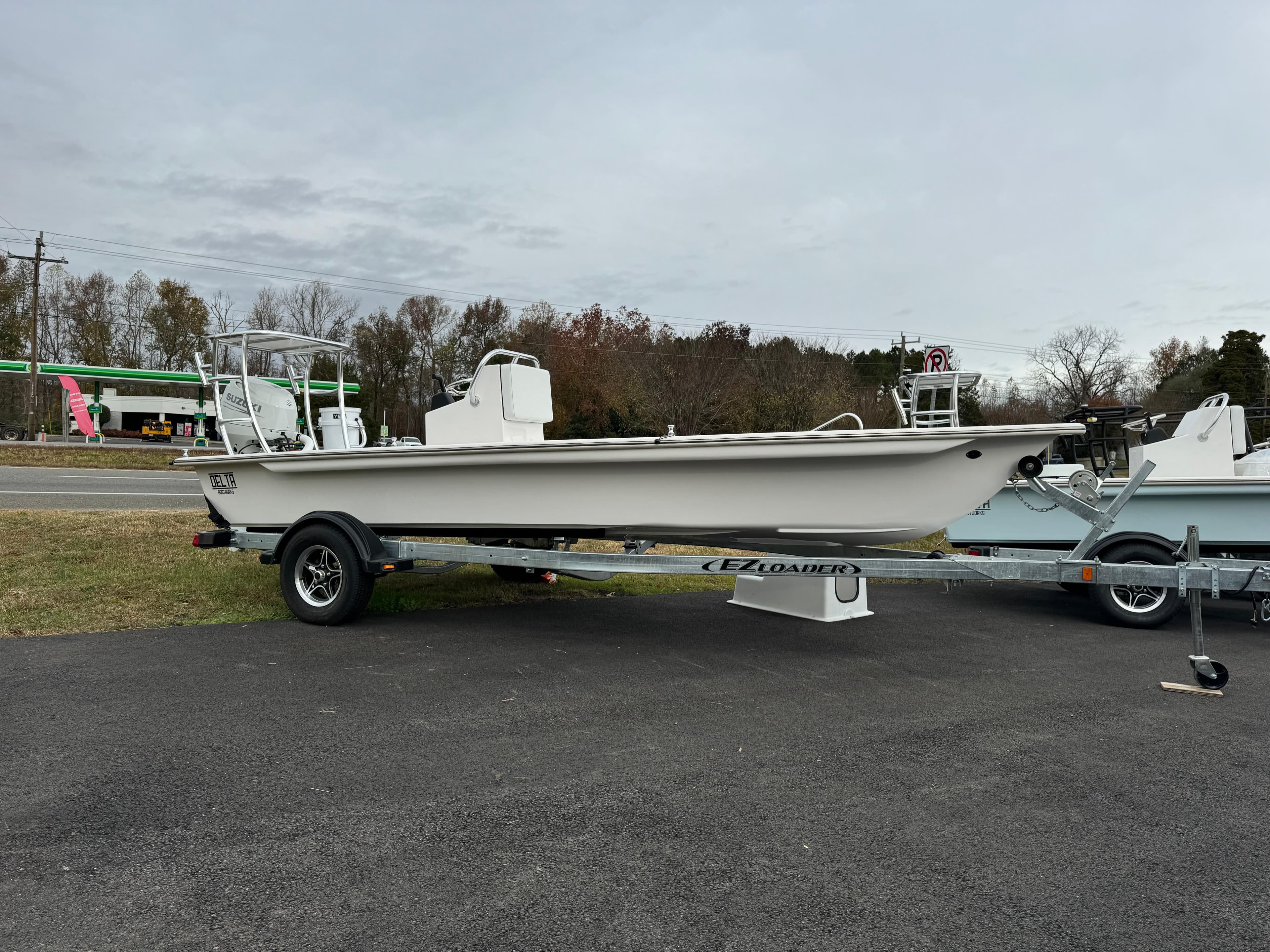 2025 Delta Boatworks Delta 18 on trailer, parked outdoors.