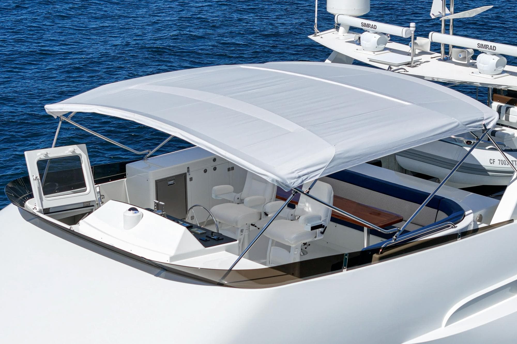 Luxurious Northcoast Yachts Raised Pilothouse, 1999 model, featuring a spacious deck and canopy.