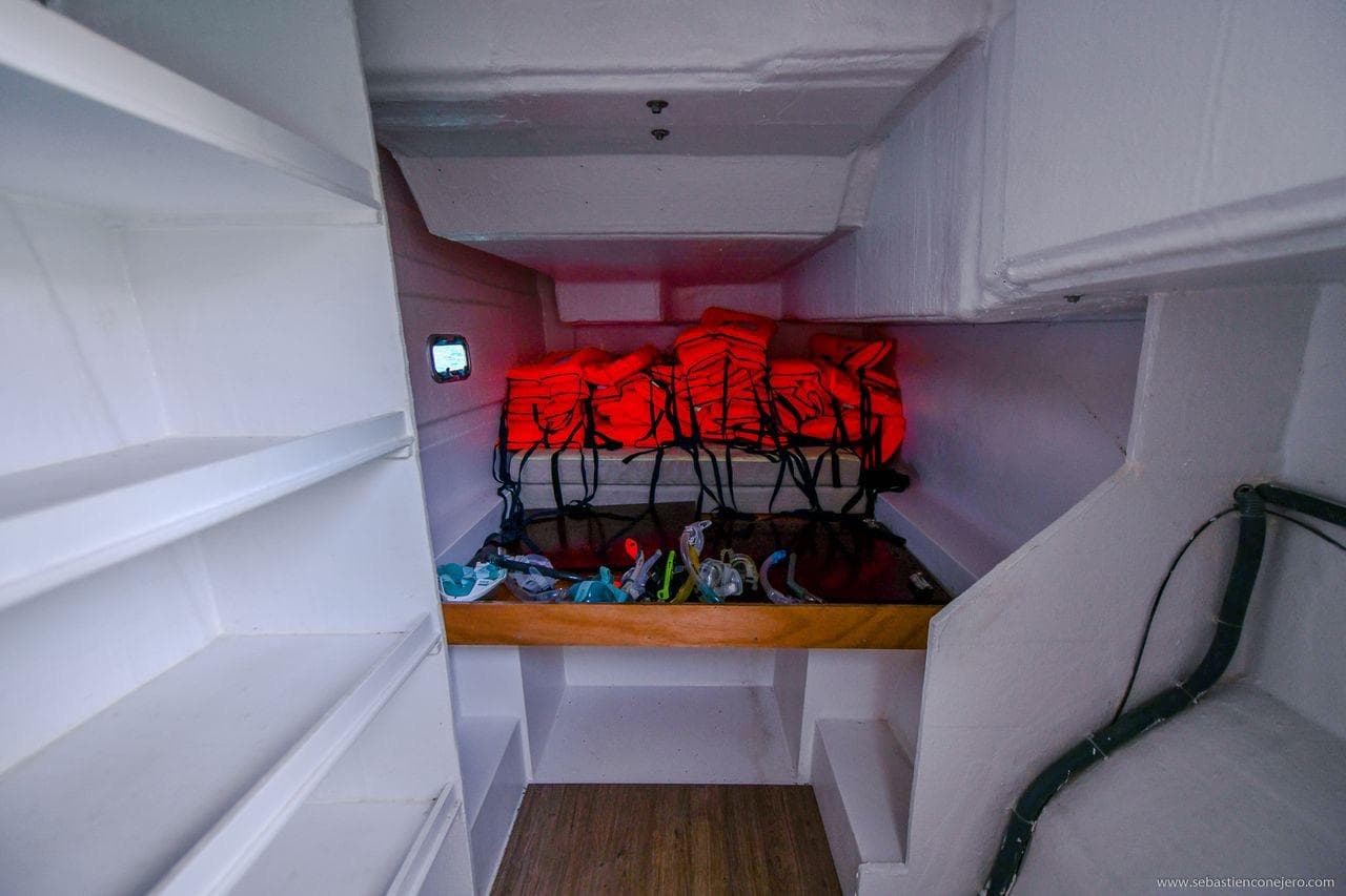 Interior storage area of 2026 Aventura Yachts 37 DC with life jackets and equipment.
