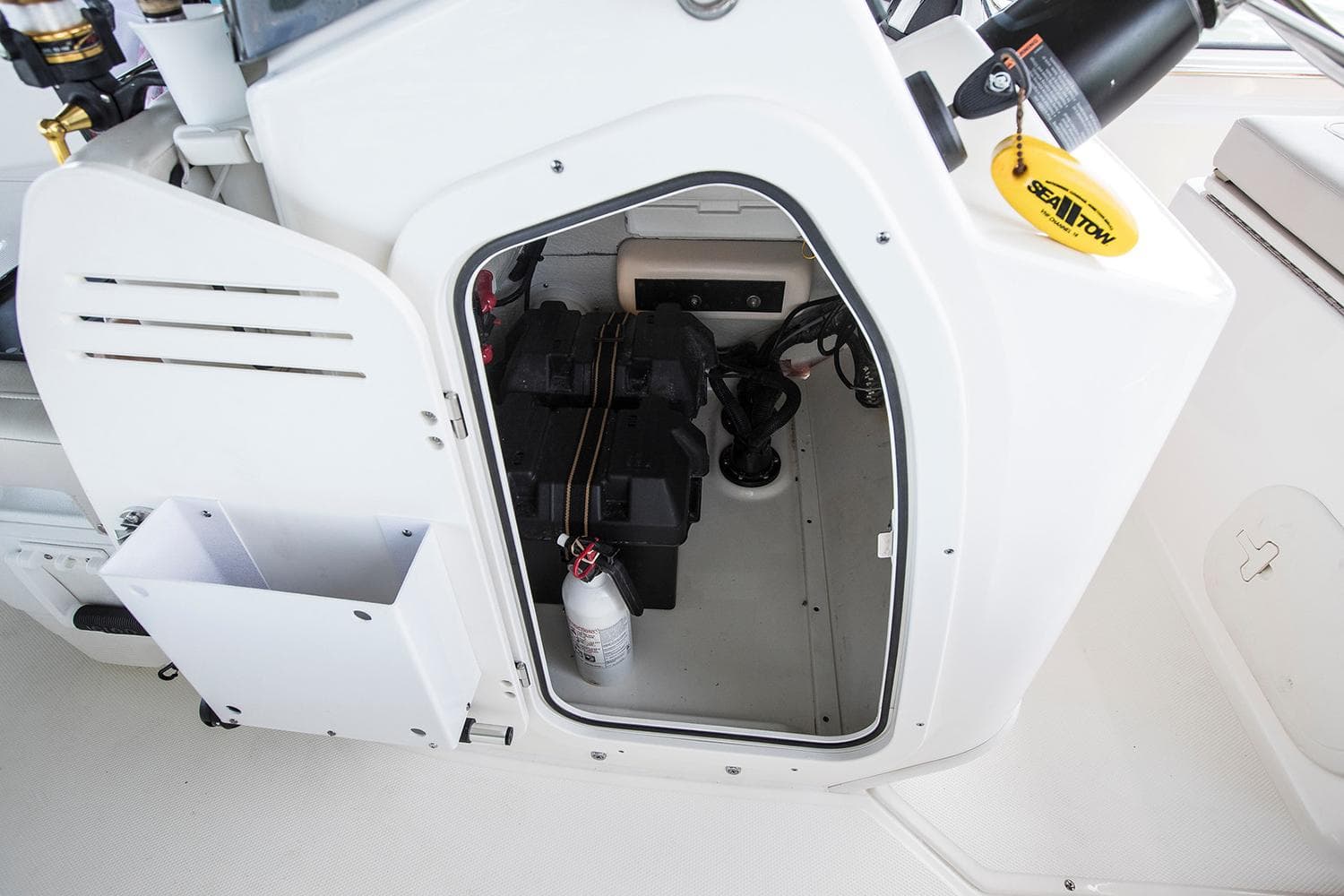 Manufacturer Provided Image: 2026 Boston Whaler 170 Montauk storage compartment with equipment and fire extinguisher.