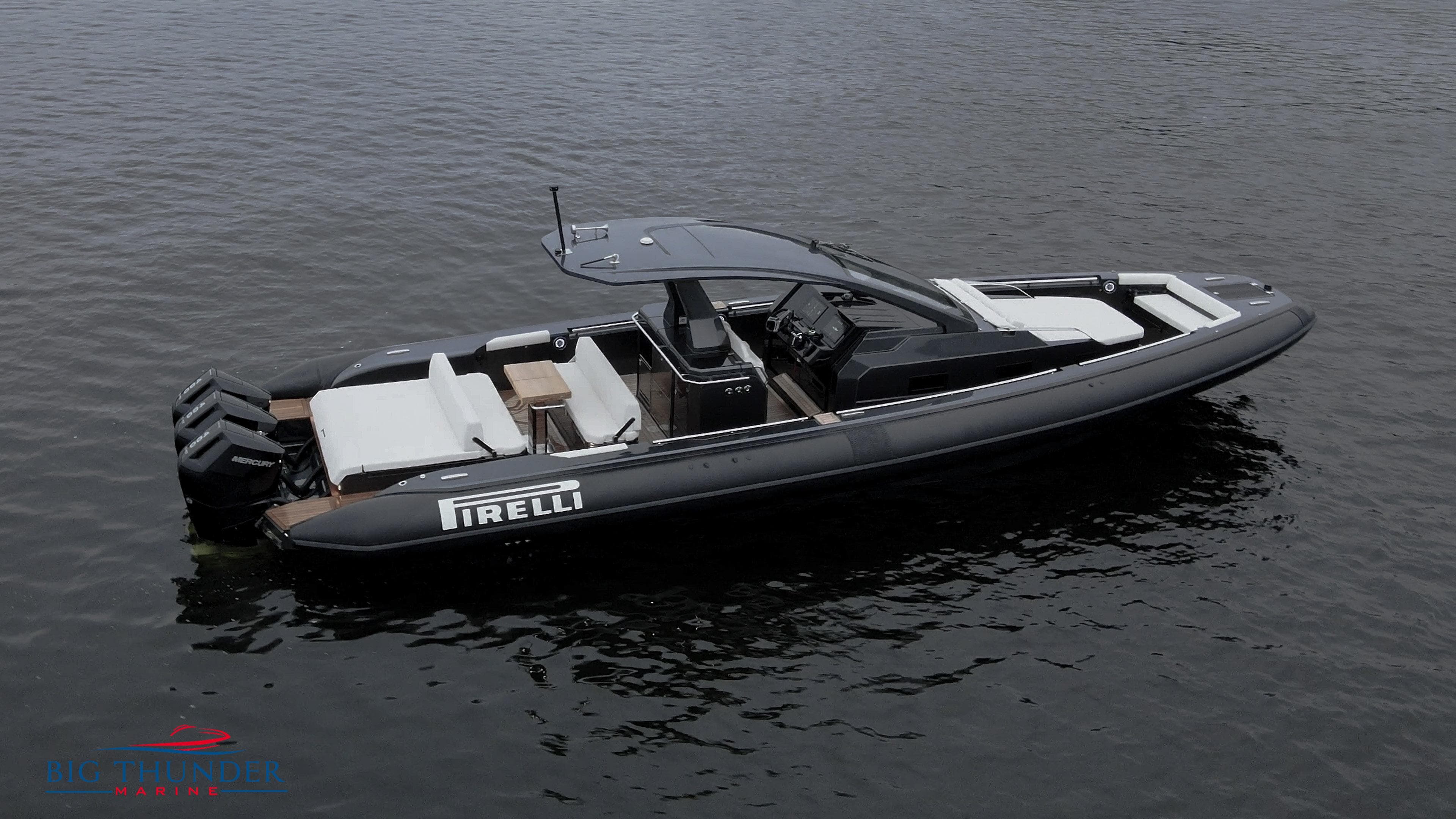 2025 Pirelli TecnoRib 42 OB luxury boat on calm water.