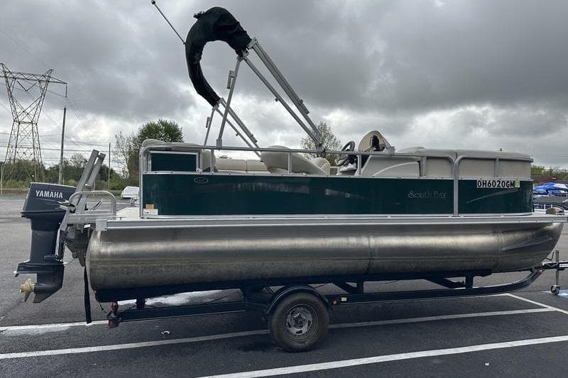 2011 South Bay 420 CR pontoon boat on trailer, featuring Yamaha outboard motor.