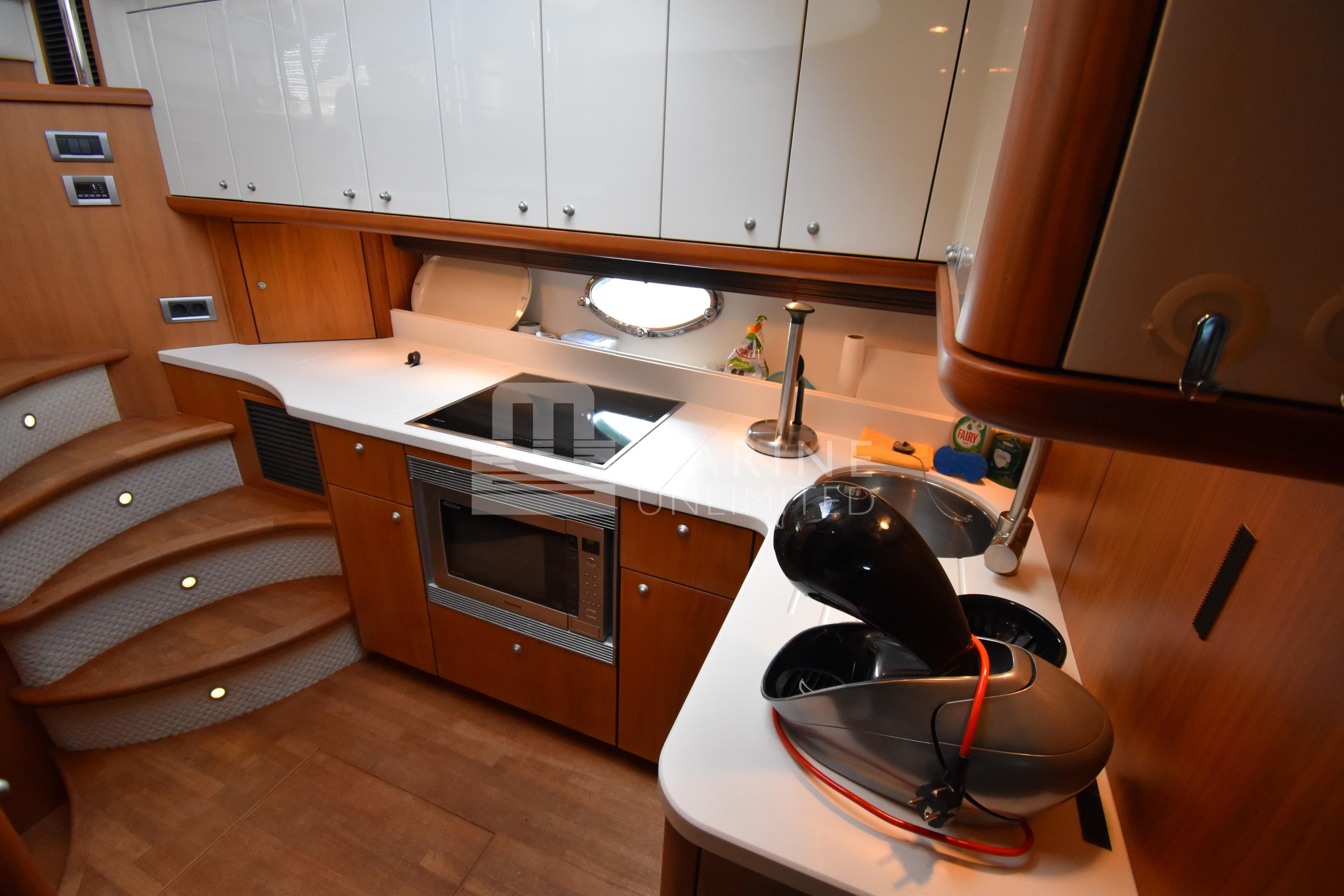 Luxurious kitchen interior of 2010 Sunseeker Manhattan 52 yacht with modern appliances.