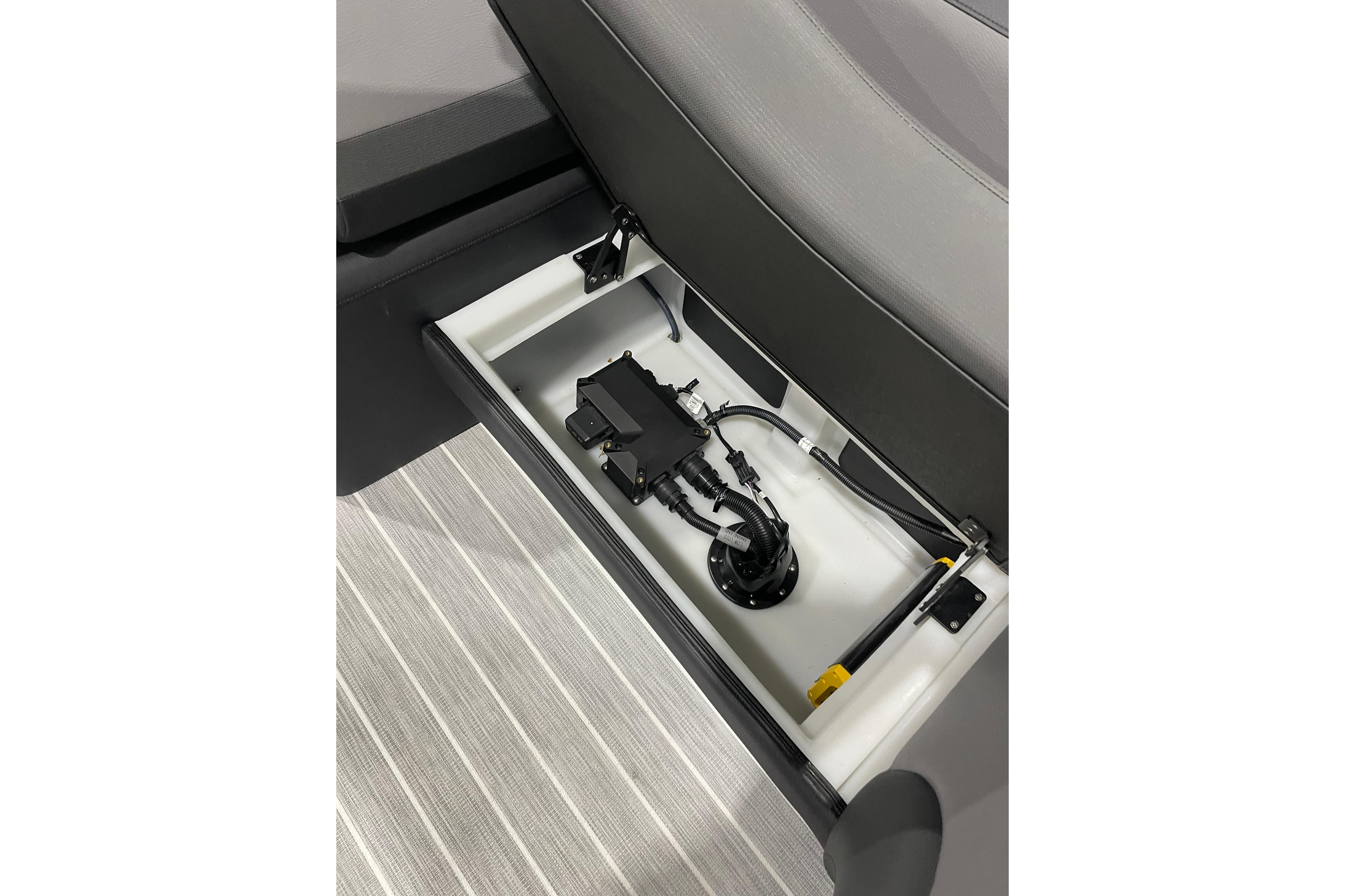 Trifecta 23RFSS 2025 seat storage with wiring and components.
