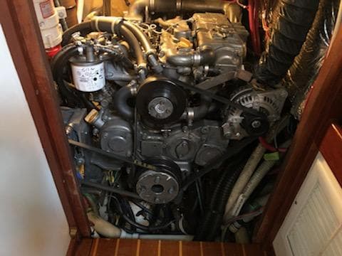 Engine room of a 2000 Cherubini Schooner, showcasing mechanical components and wiring.