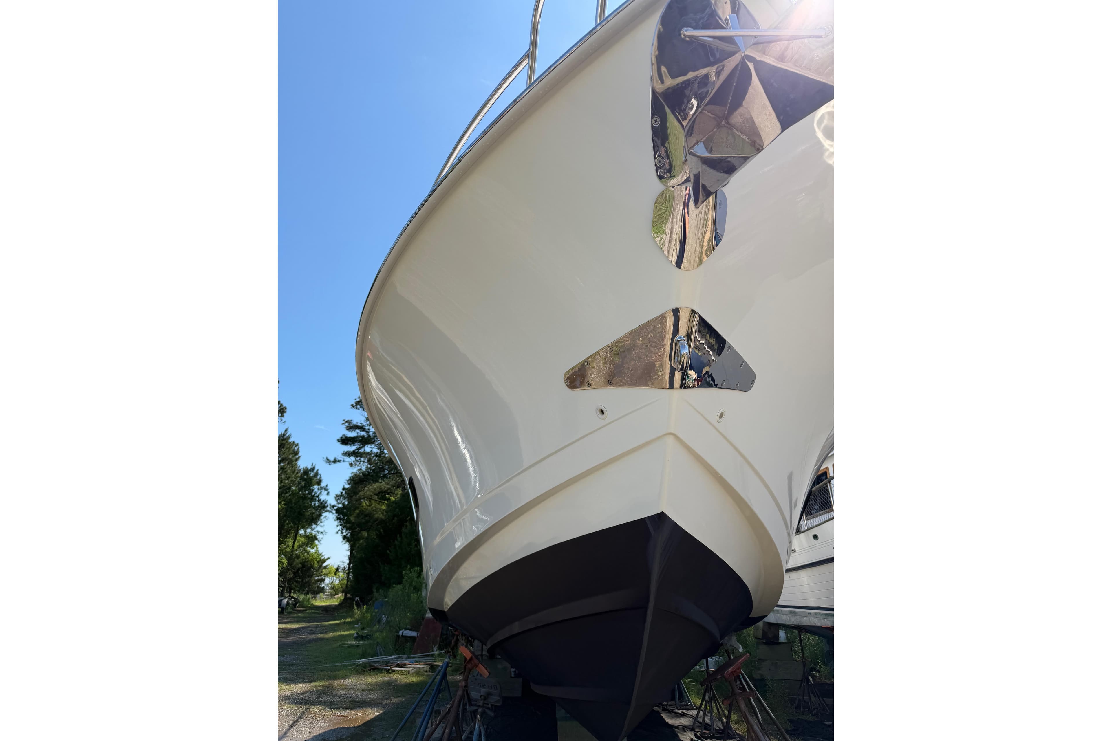 2017 Boston Whaler 420 Outrage boat hull, viewed from below, in a sunny outdoor setting.