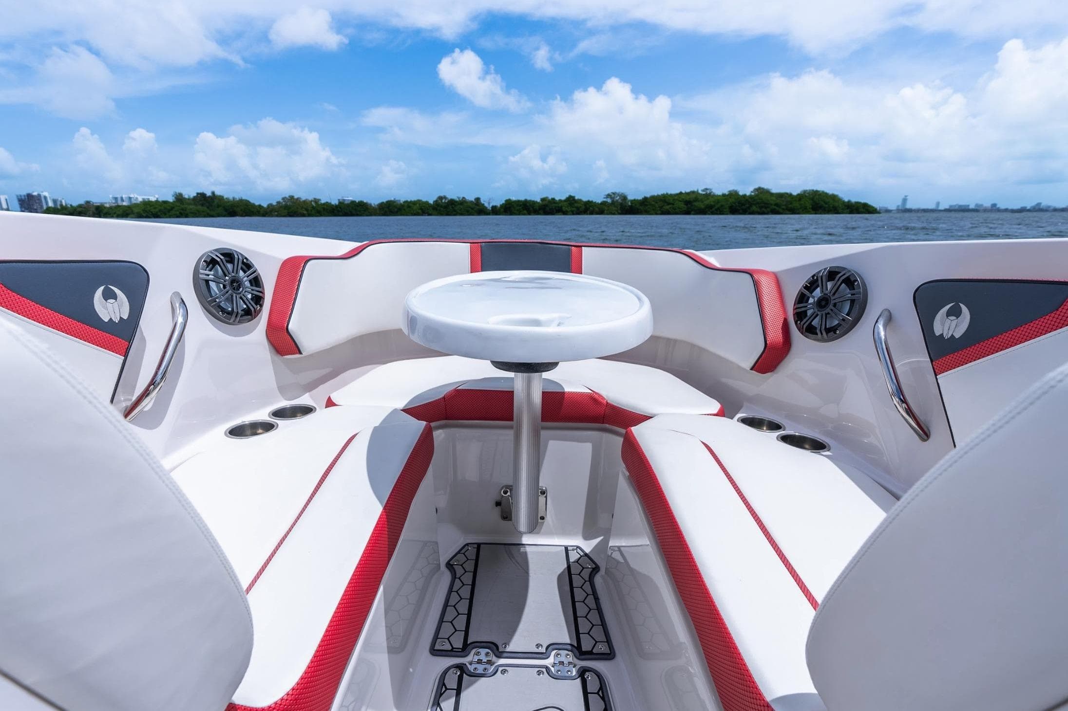 2017 Scarab 255 H.O. Impulse boat interior with red accents and seating, on a sunny day.