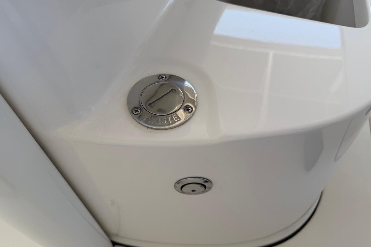 Key West 239 FSR 2026 boat waste cap on white surface.