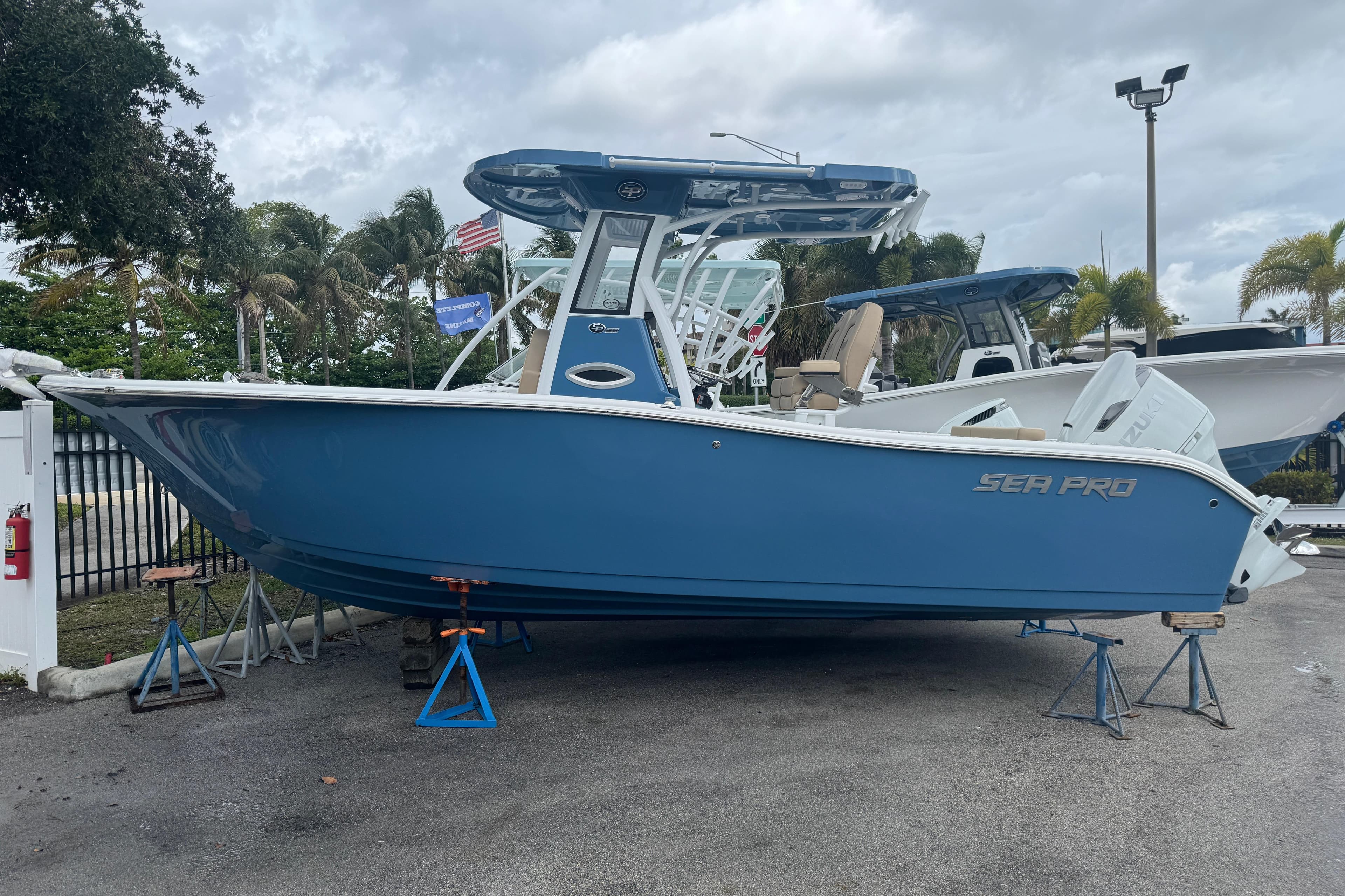 2026 Sea Pro 242 Center Console boat on stands outdoors.