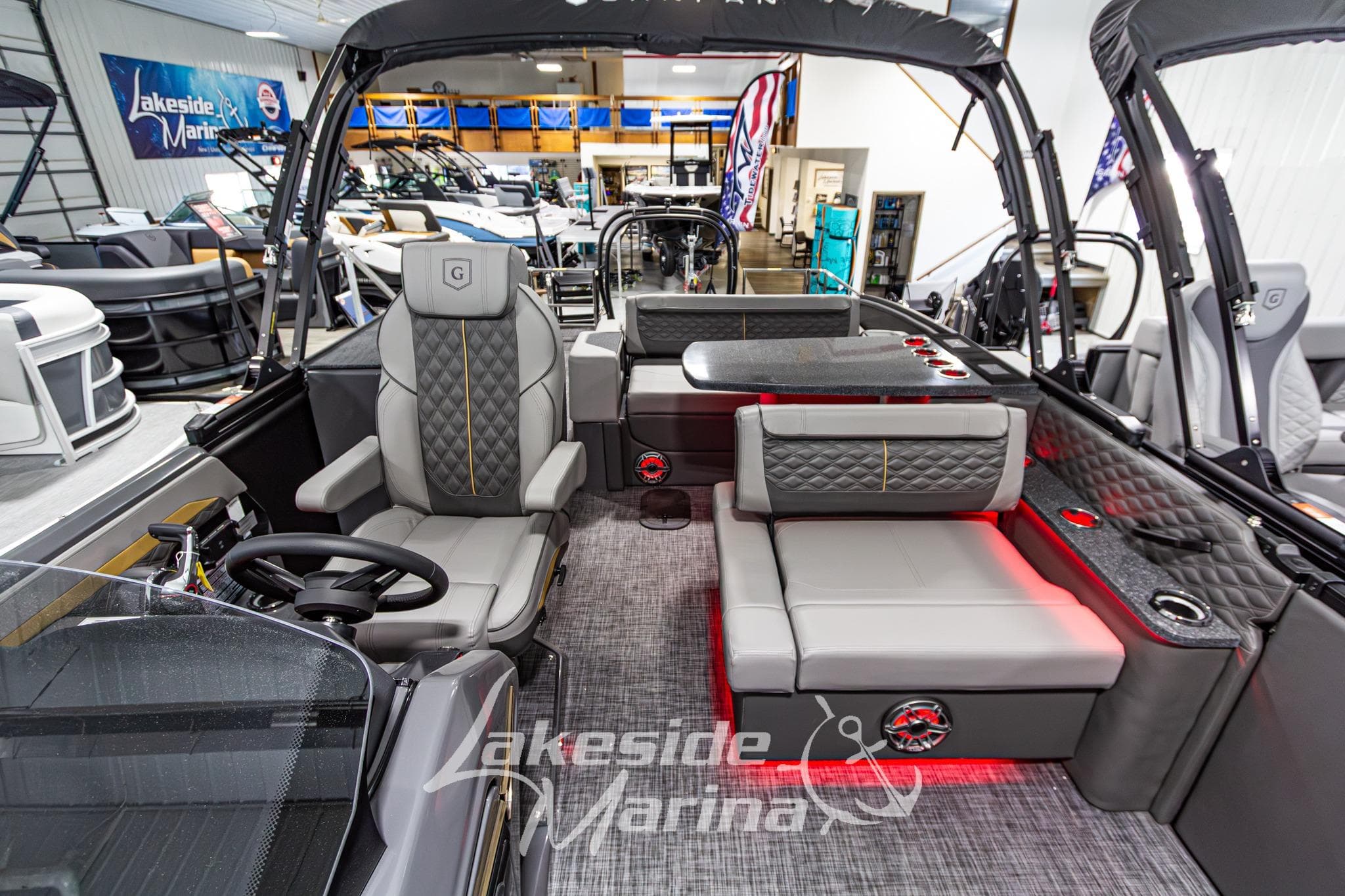 2026 Godfrey Sanpan 2700 MTF pontoon boat interior at Lakeside Marina showroom.