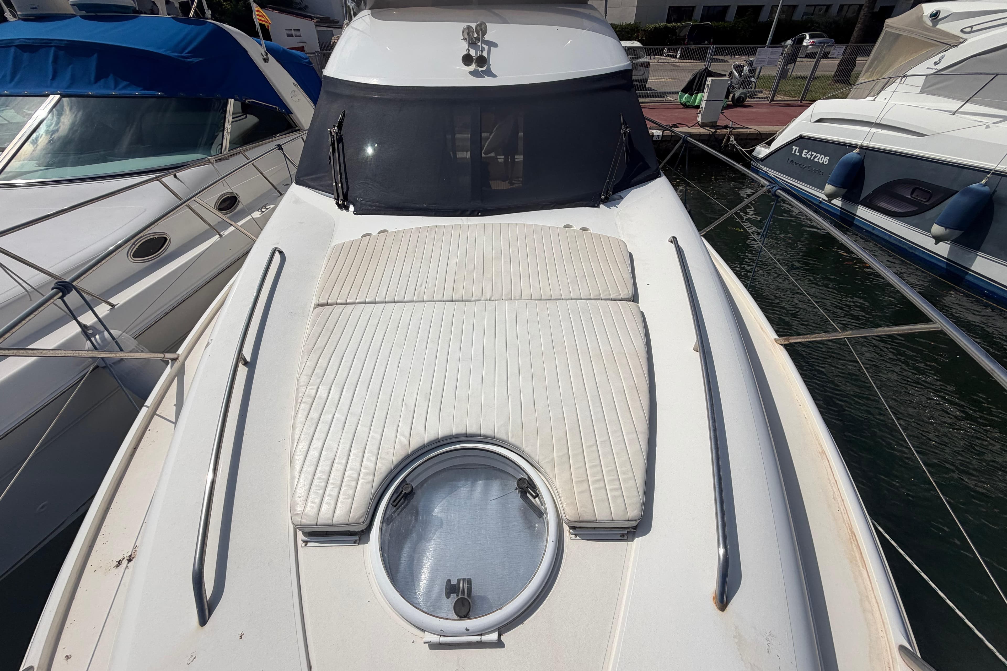 Front deck of a 2000 Princess 38 yacht, docked at a marina.