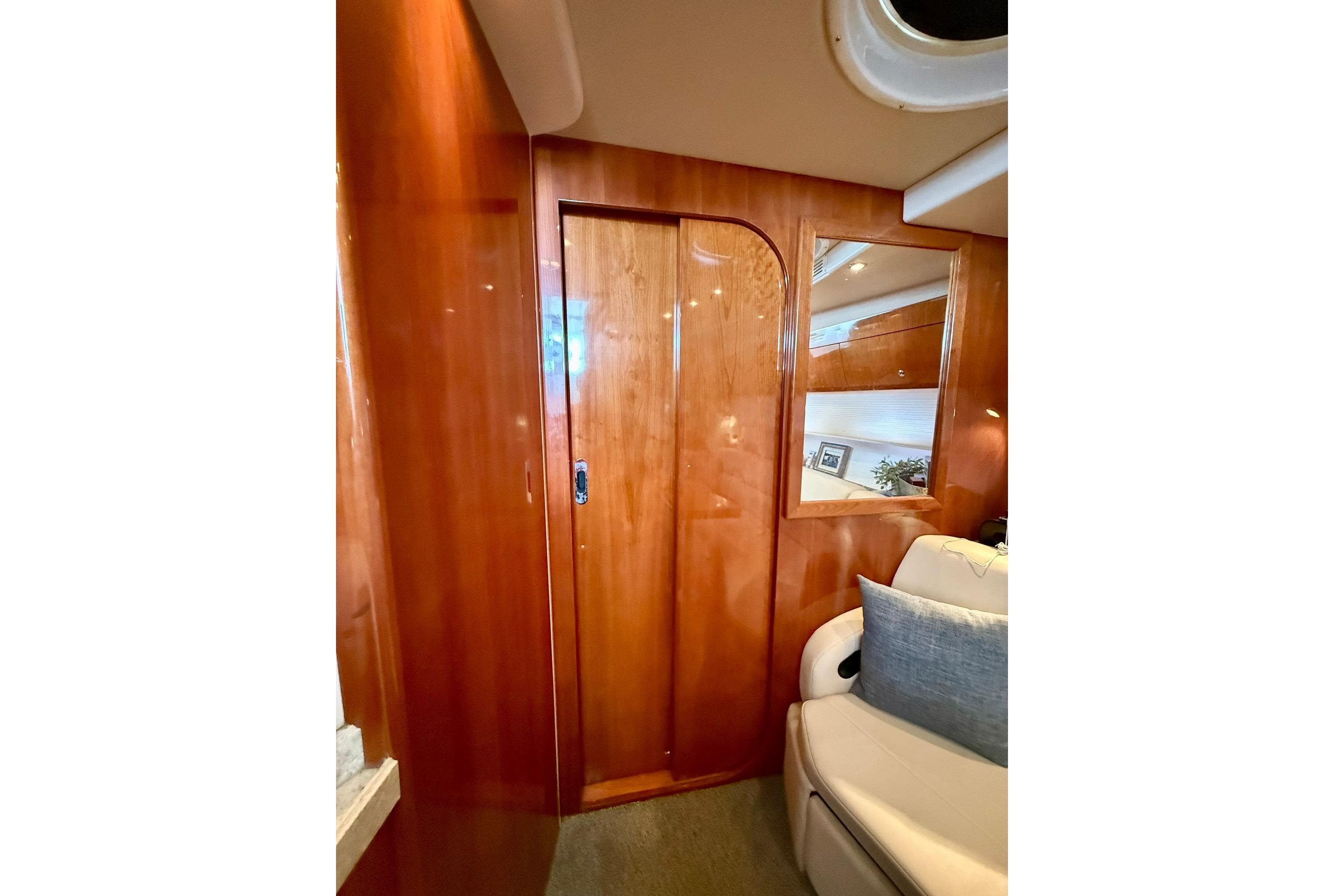 Interior of 2006 Regal Commodore 4060 yacht with wooden paneling and seating.