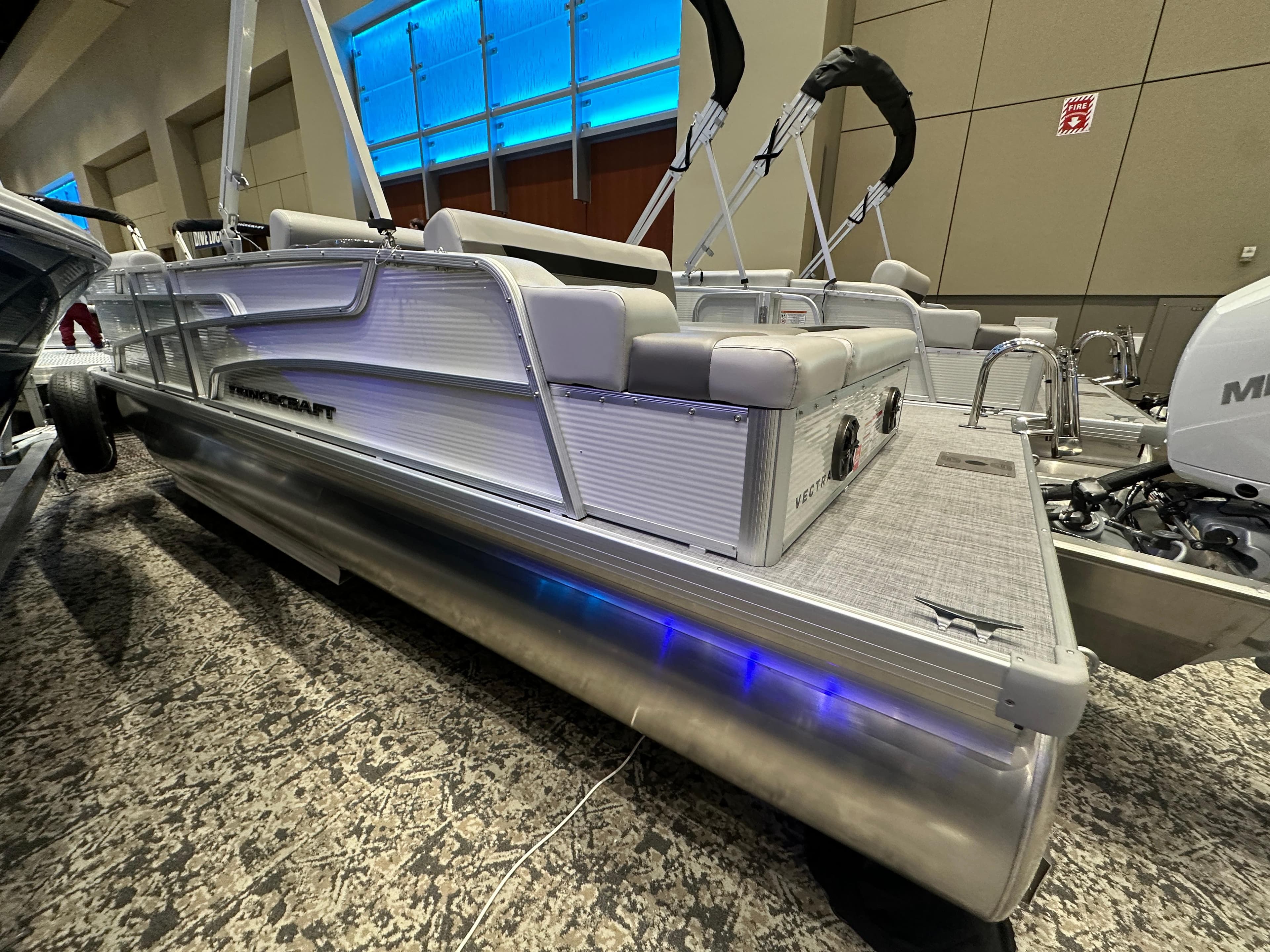 2025 Princecraft Vectra 21 RL pontoon boat with modern seating and blue LED lighting.