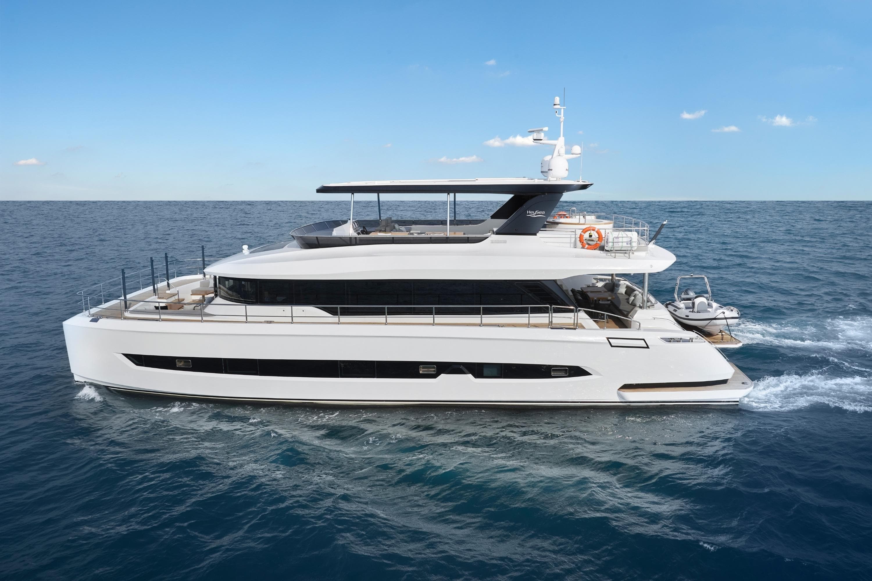 2026 Heysea V75 yacht cruising on open sea under clear blue sky.