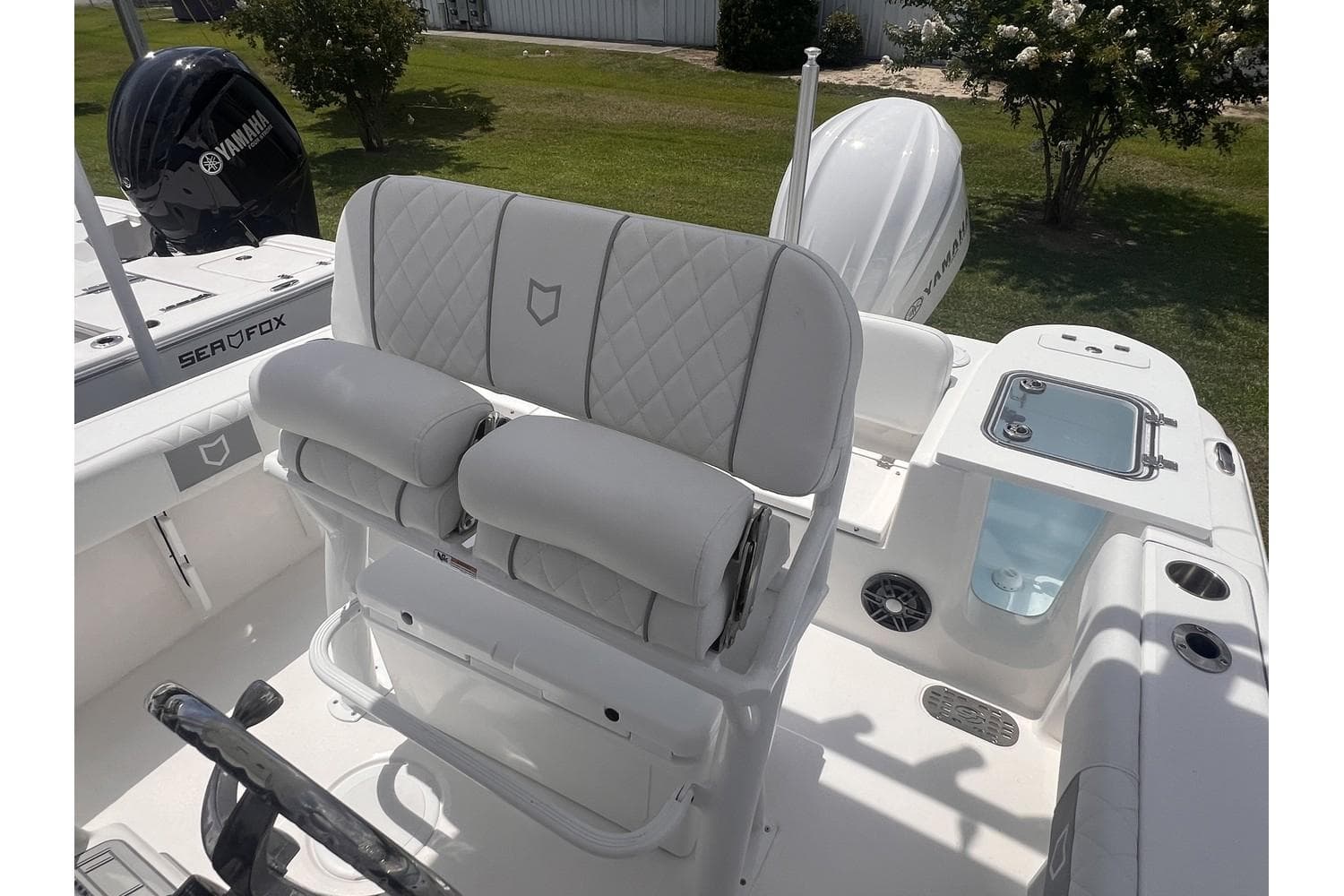 2025 Sea Fox 228 boat interior with cushioned seating and Yamaha engine.