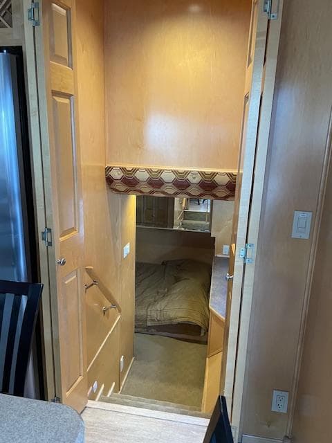 Interior of 2007 American Waterways Houseboat Sundancer Trip #17, showing cozy sleeping quarters.