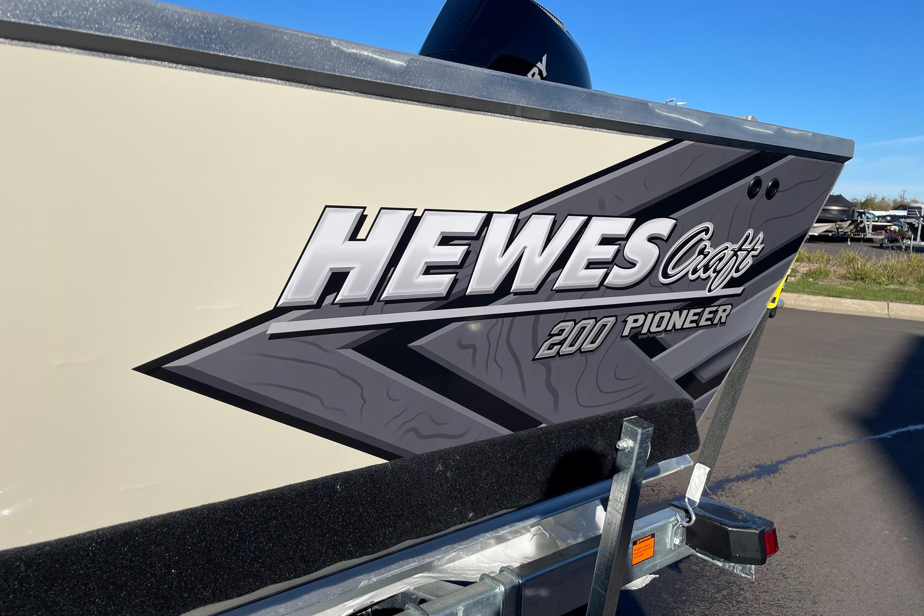 2026 Hewescraft 200 Pioneer boat with bold logo on trailer.
